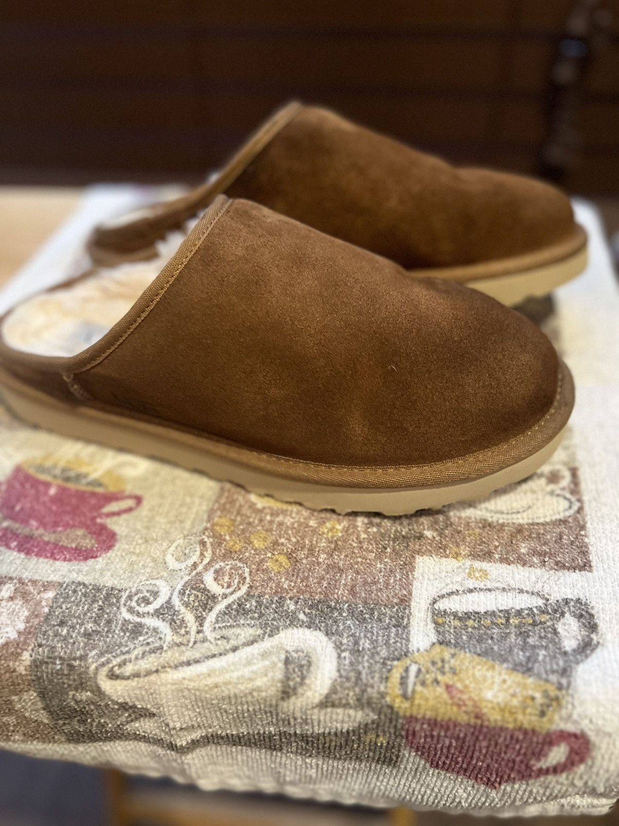 Authentic UGG Brown Suede slip on outdoor slippers.