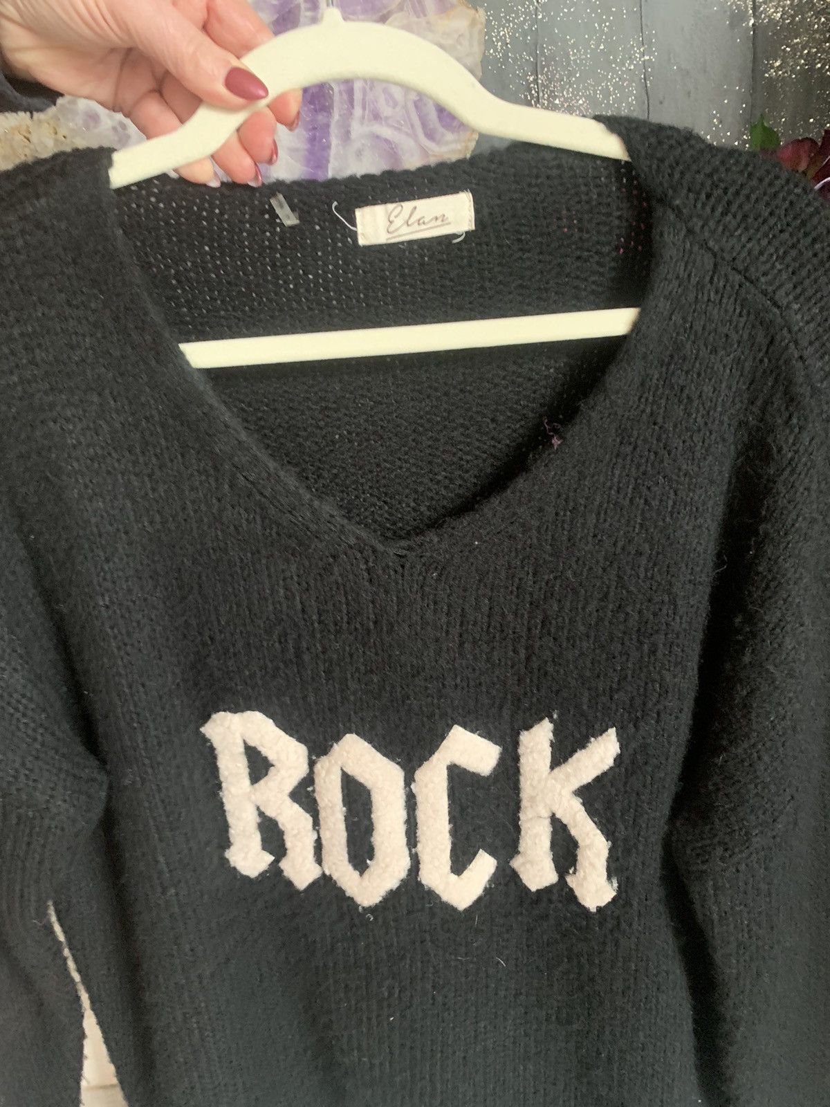 Elan black rock and roll sweater size is small