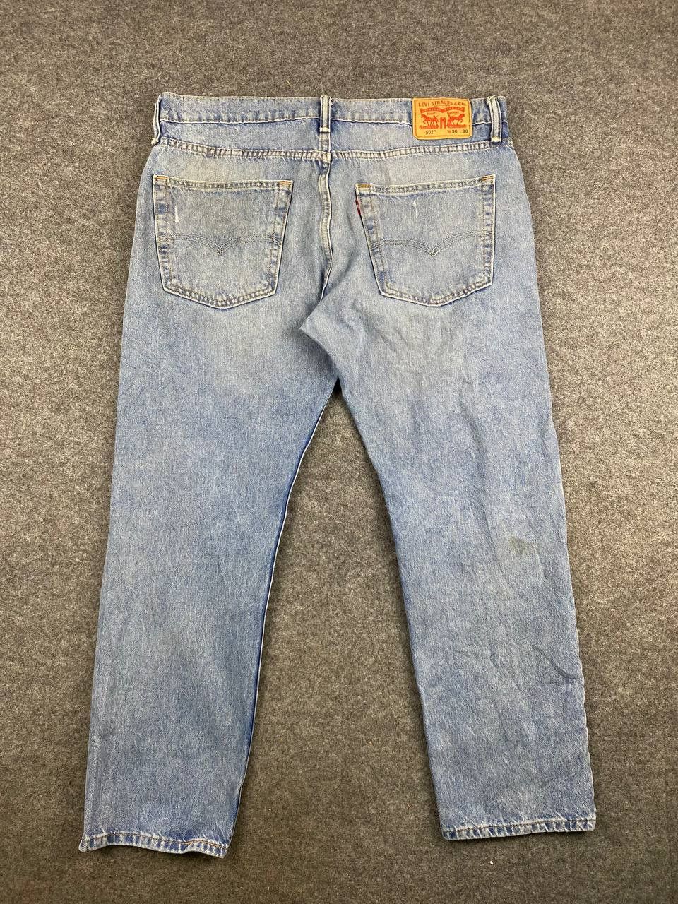 image of 502 Regular Tapered Distressed Denim in Light Blue, Men's (Size 39)