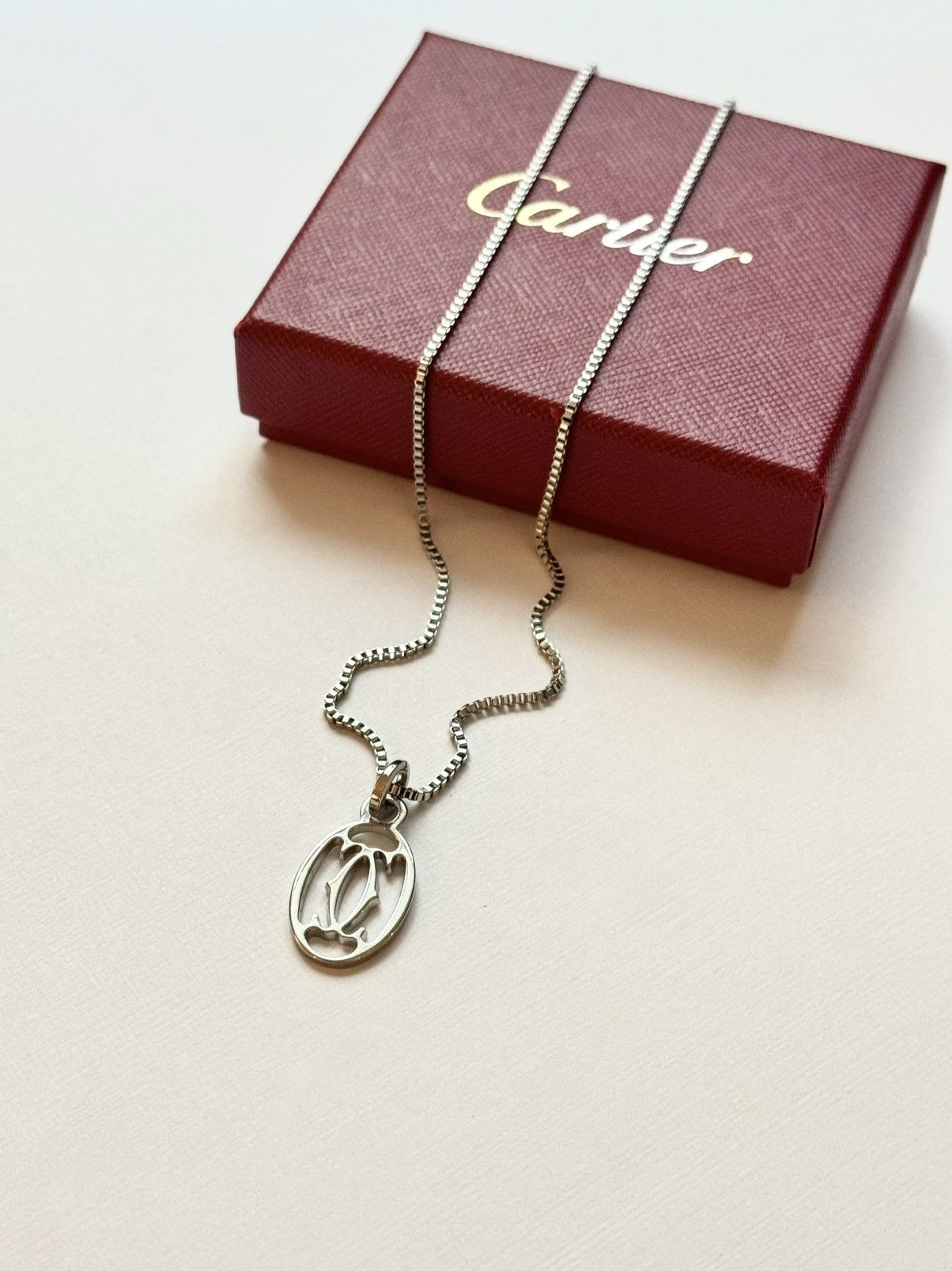 Cartier Cartier Silver Interlocking CC Pendant on Chain/Necklace | Grailed