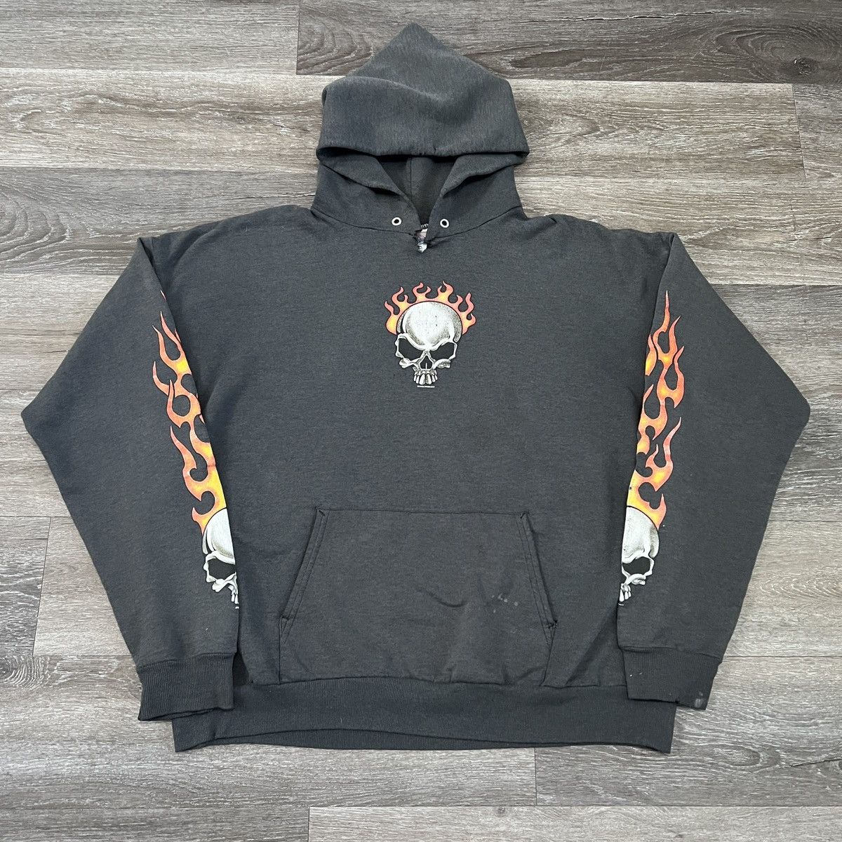 Image of Vintage Y2K Tribal Flame Skull Faded Black Jnco Style Hoodie, Men's (Size XL)