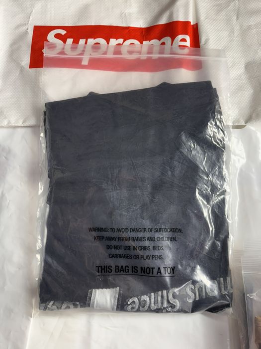 Supreme Supreme Intarsia Spellout S/S Top Black tee | Grailed