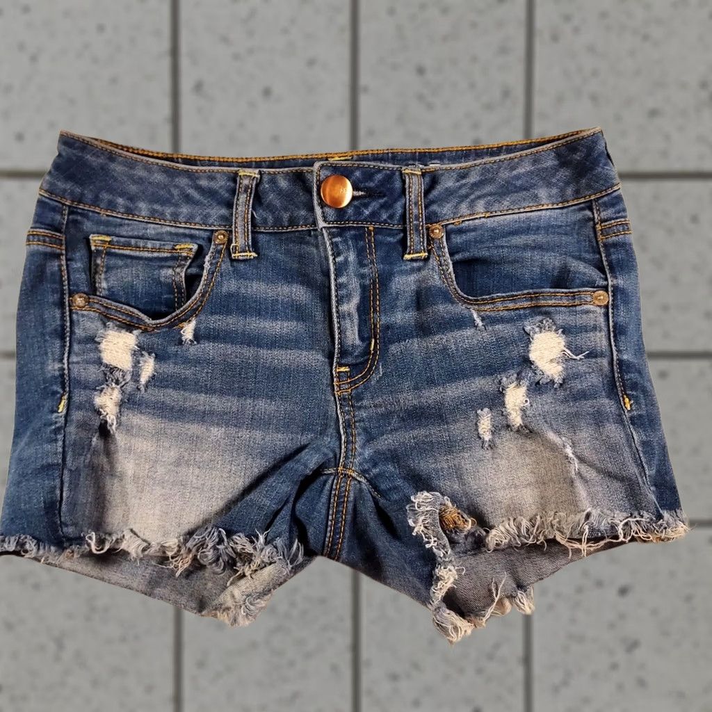 American Eagle Outfitters American Eagle Outfitters Super Stretch Jean Shorts Size 4 Flat Front Zip 4 Inseam Blue Distressed Frayed Hem Women Regular Hi Rise Shortie Shorts Size 27" / US 4 / IT 40 - 1 Thumbnail