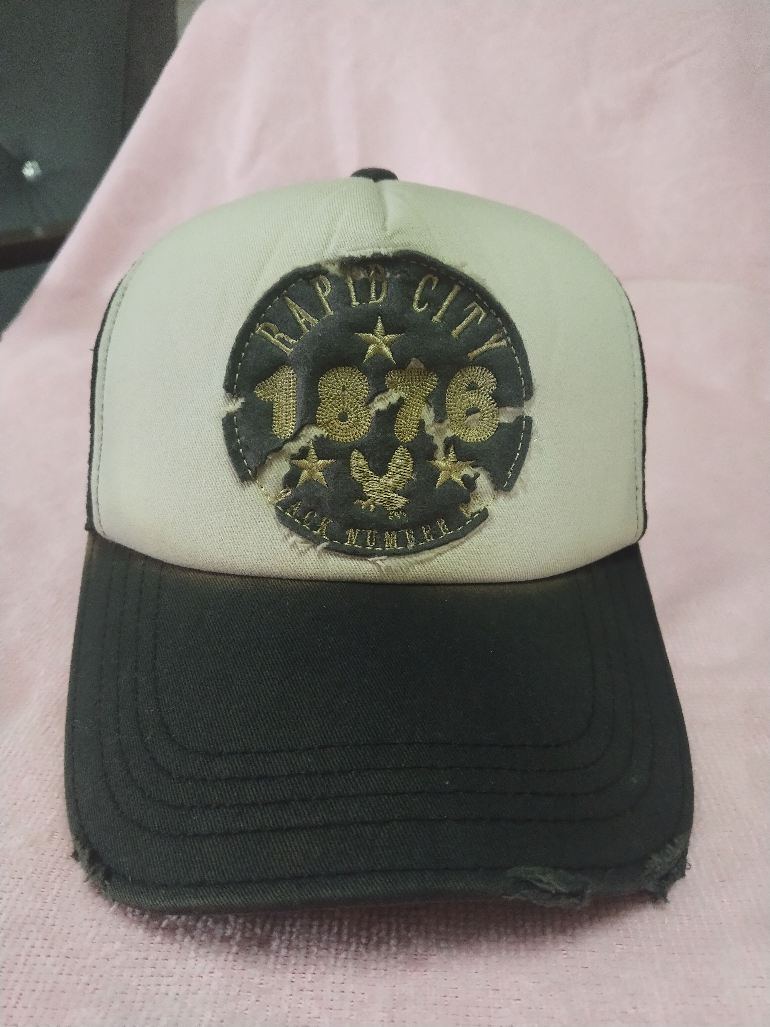 SUN FADED RAPID CITY 1876 BACK NUMBER TRUCKER HAT