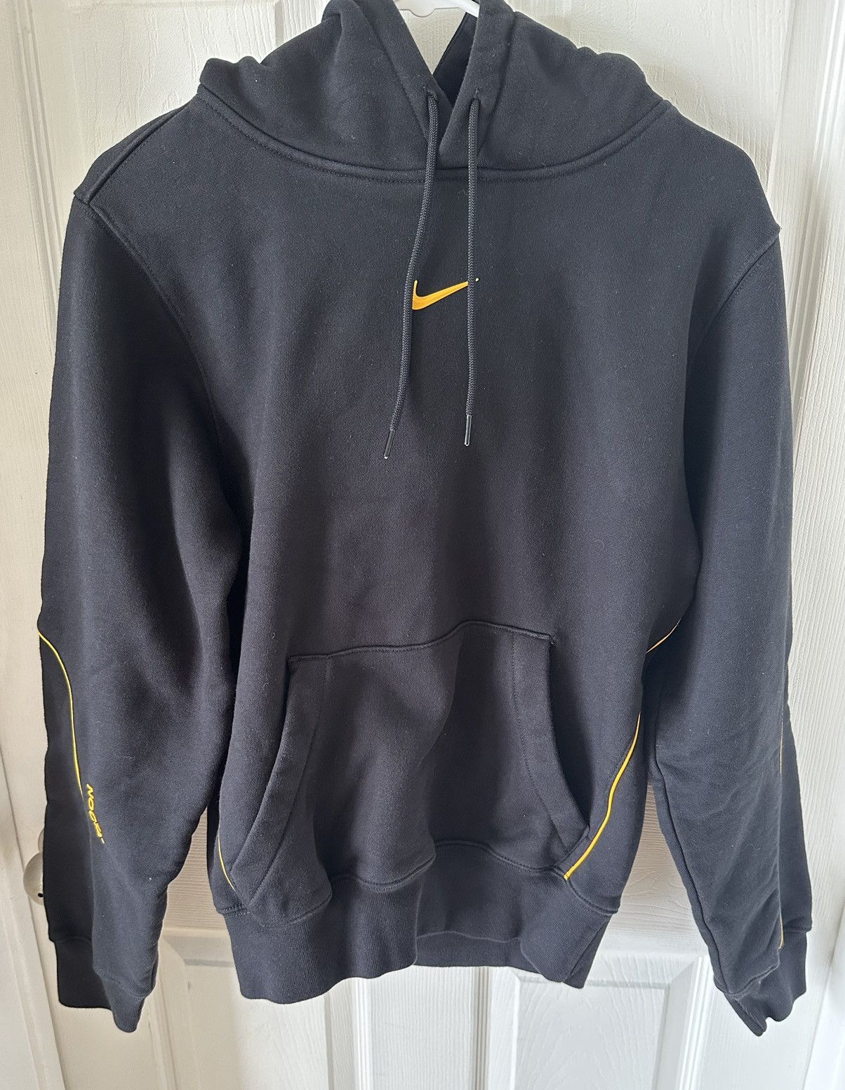 image of Drake Nocta Cardinal Stock Hoodie Navy in Black, Men's (Size Small)