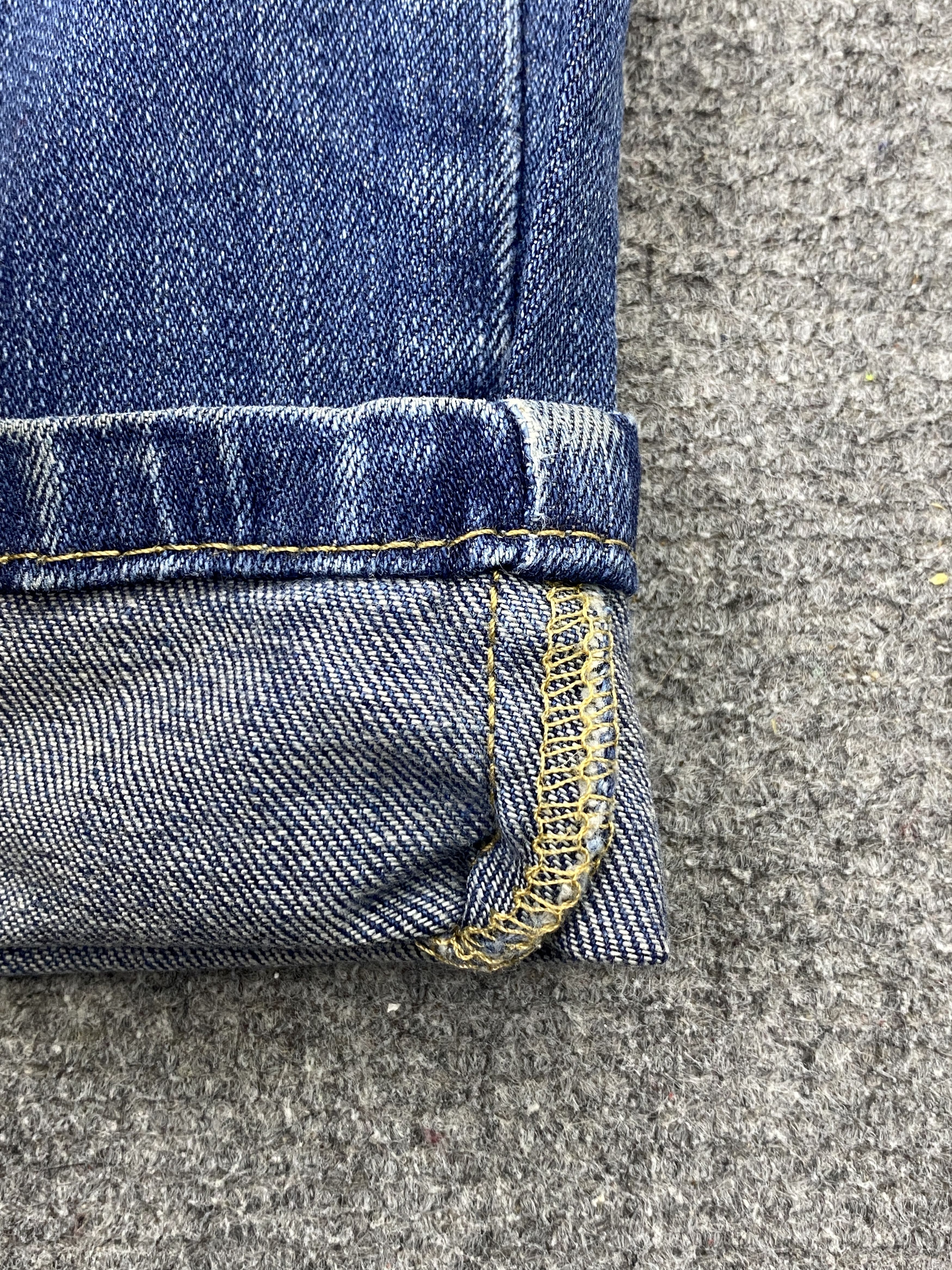 Distressed Vintage Levi's 514 Faded Blue Jeans