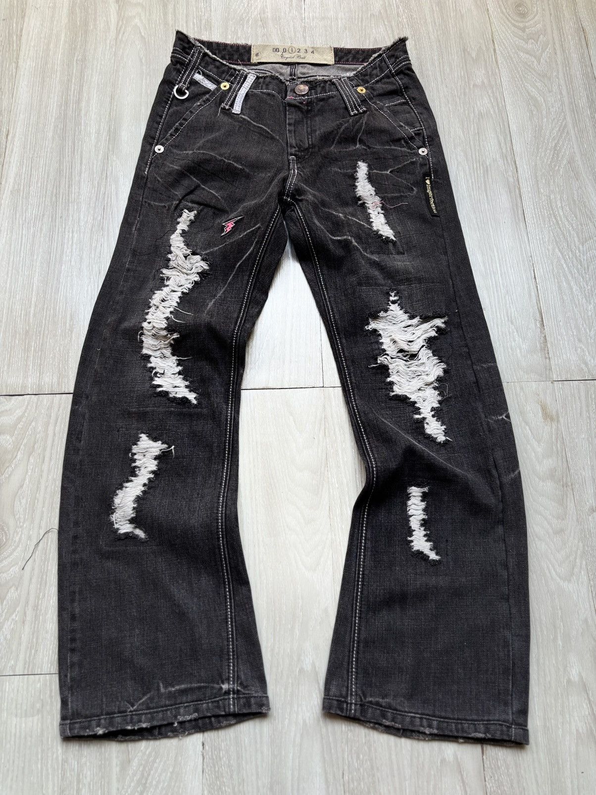 Crystal ball distressed phyton flare jeans