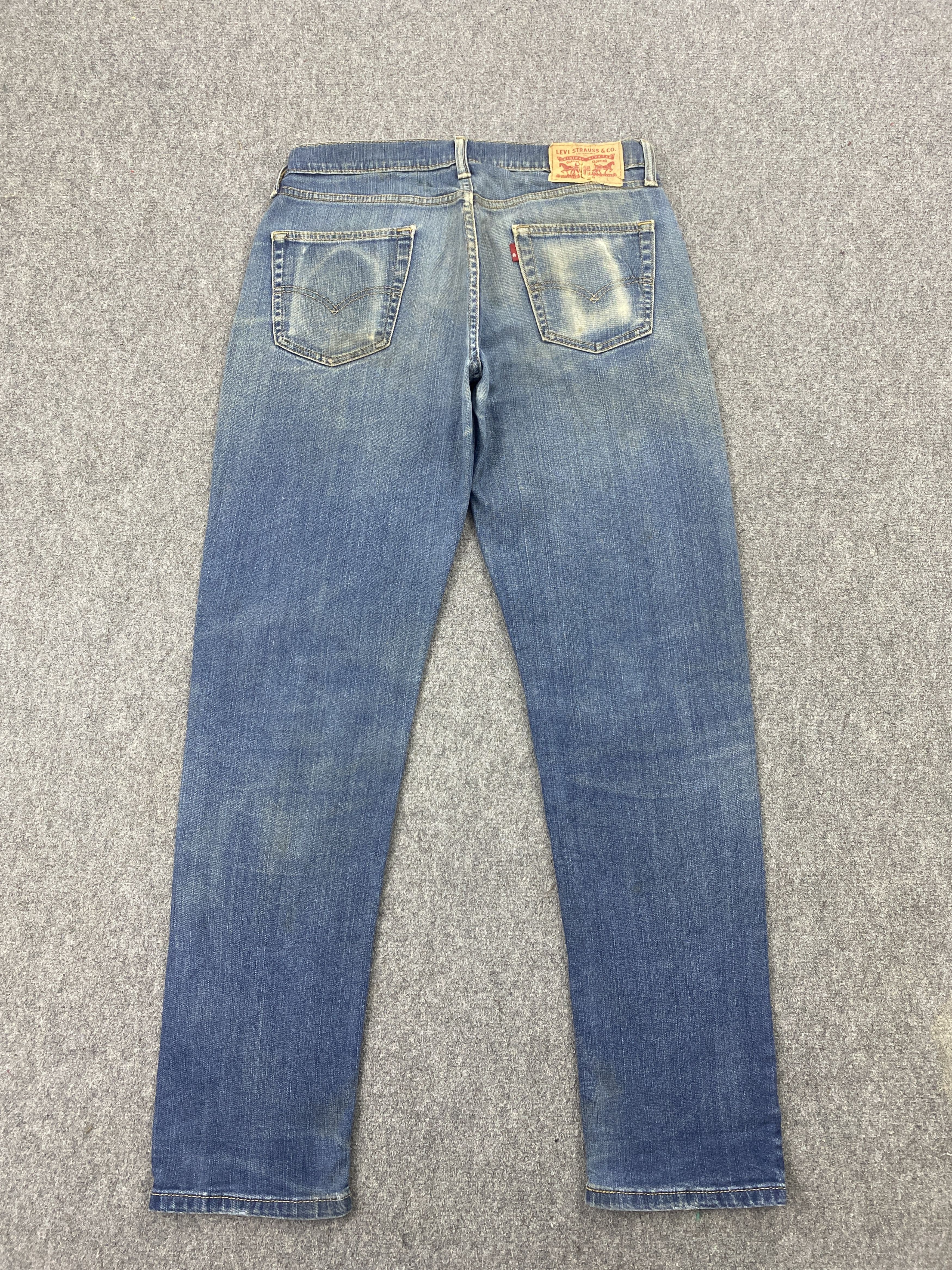 Distressed Vintage Levi's 514 Faded Blue Jeans
