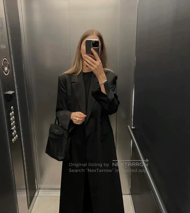 The row Black windbreaker coat