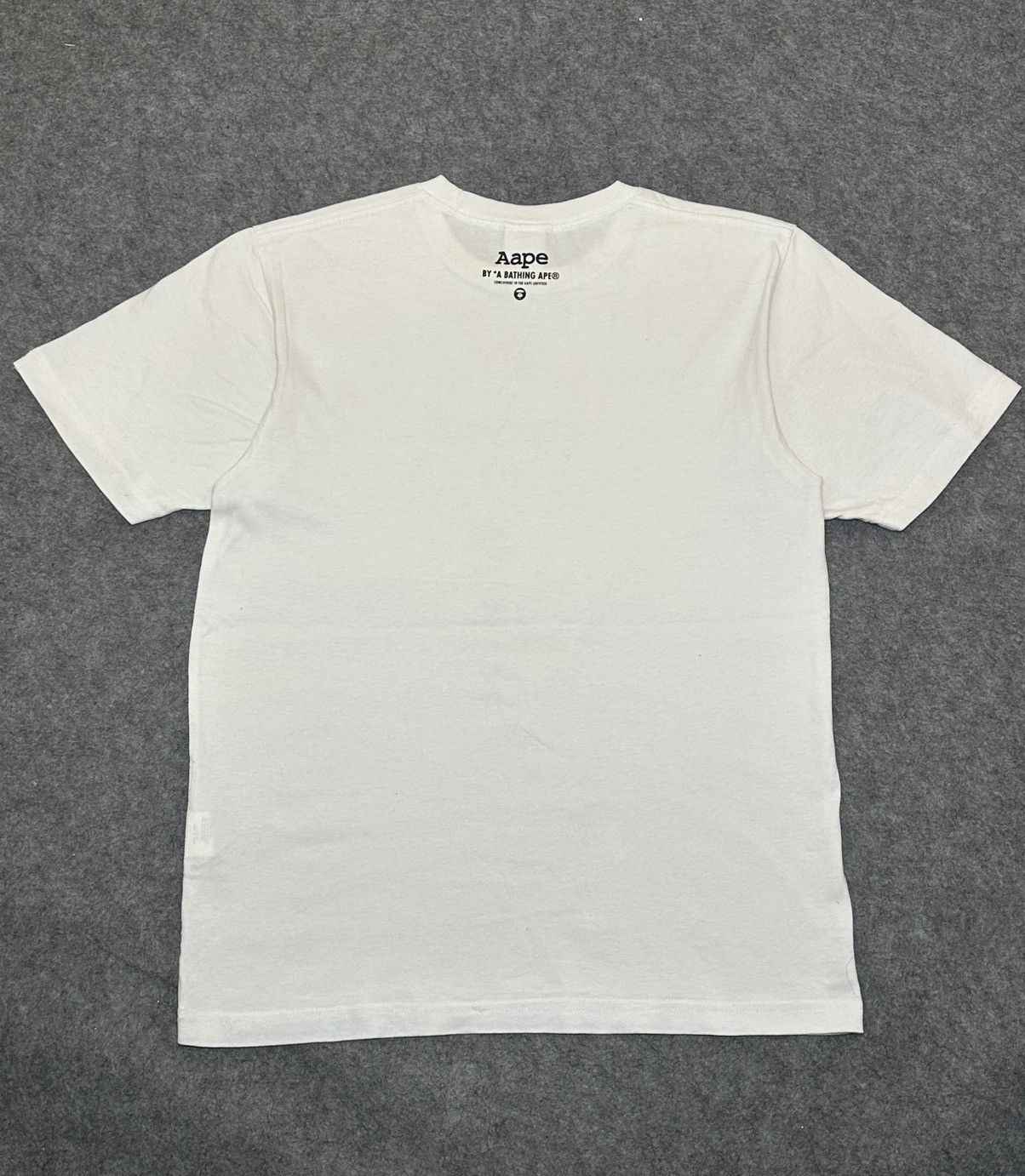Aape AAPE by A Bathing Ape Moon Face Camo T-shirt in white. Size US M / EU 48-50 / 2 - 3 Thumbnail