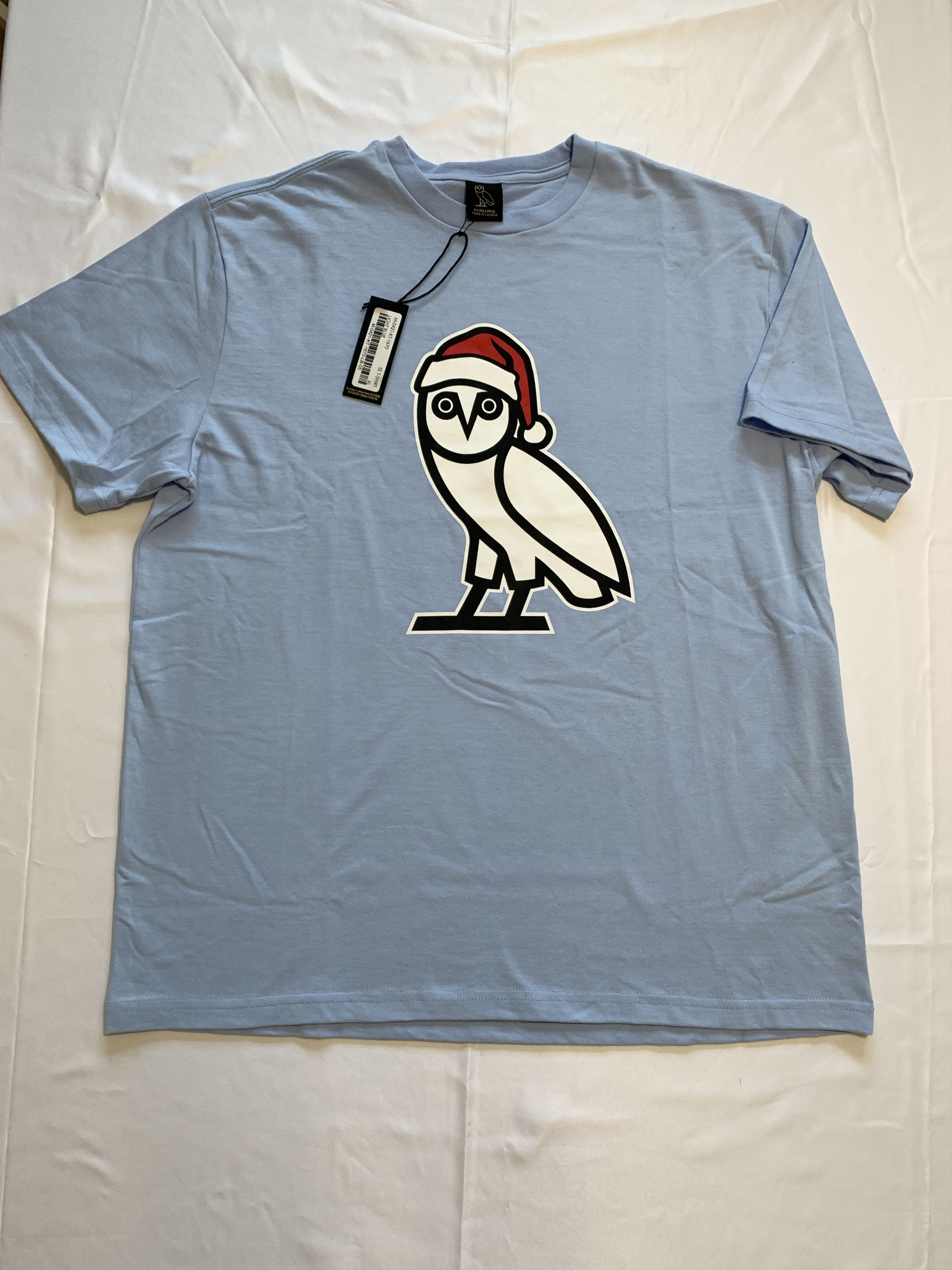 Drake OVO Holiday Santa OG Owl T-shirt Sky Blue Size US XL / EU 56 / 4 - 1 Thumbnail