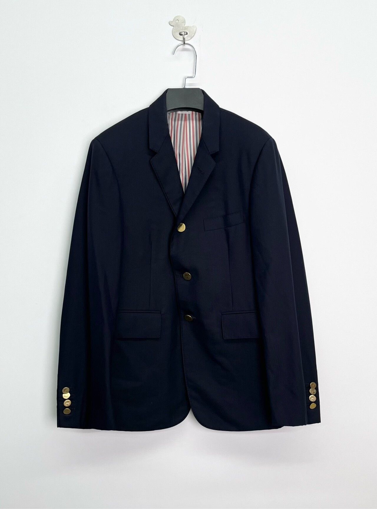 navy blazer with gold anchor details