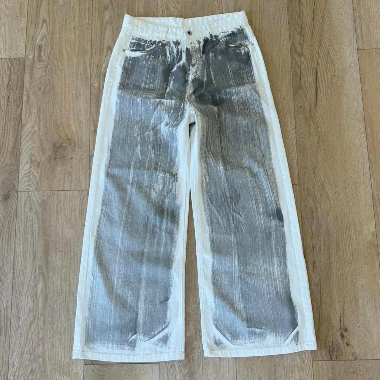 White and grey wide leg jeans with paint splatter design
