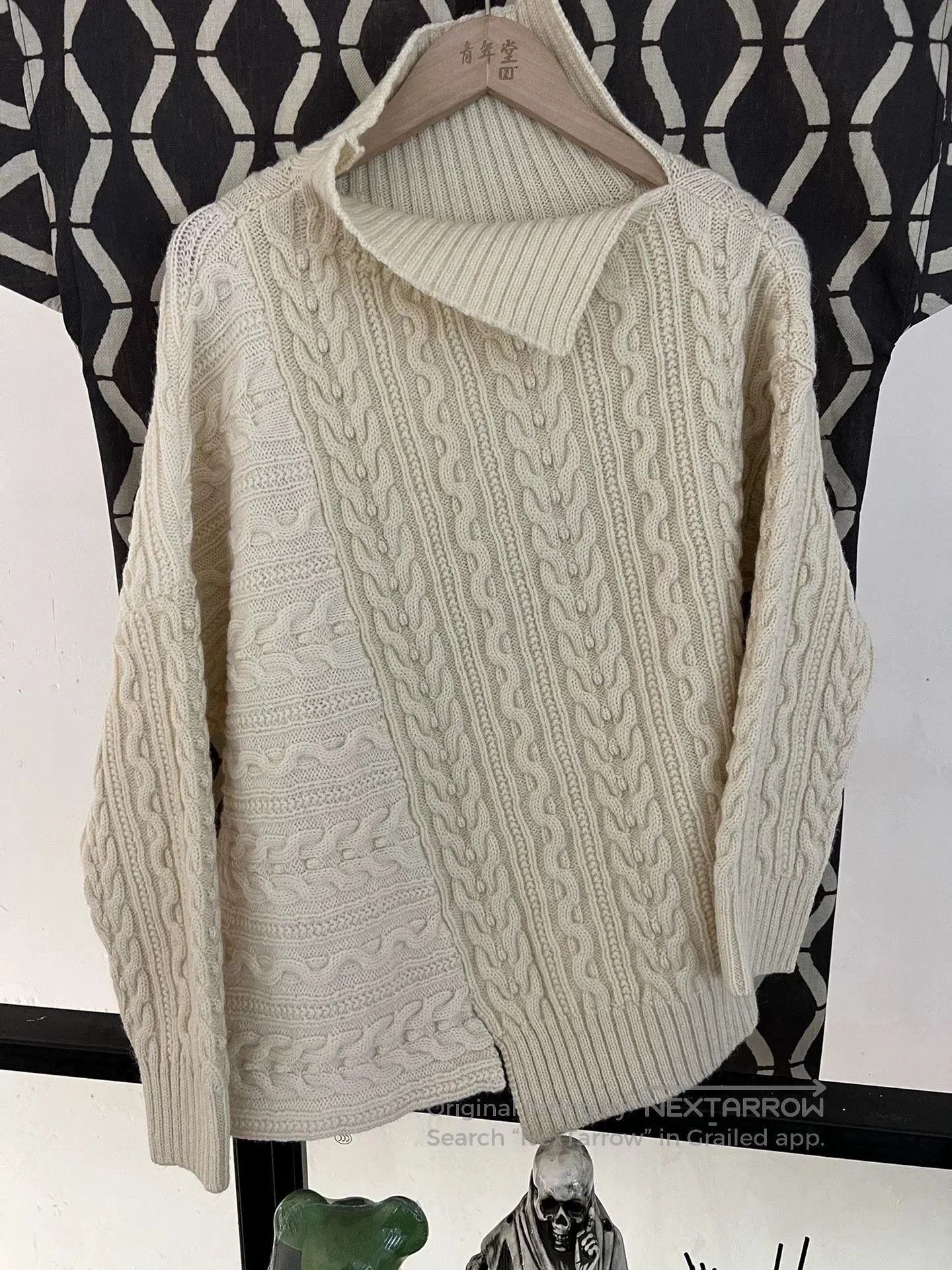 light beige irregular knit turtleneck sweater.