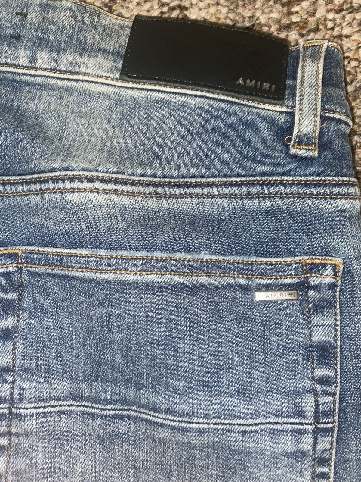 Amiri suede appliqué logo jeans