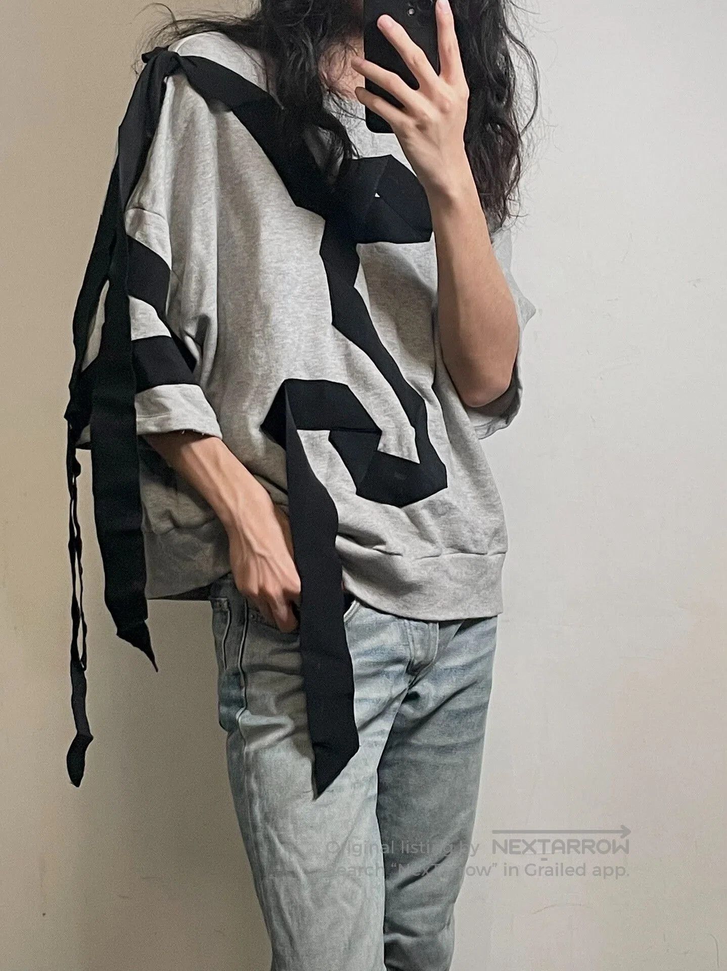 gray oversized hoodie with ribbons.