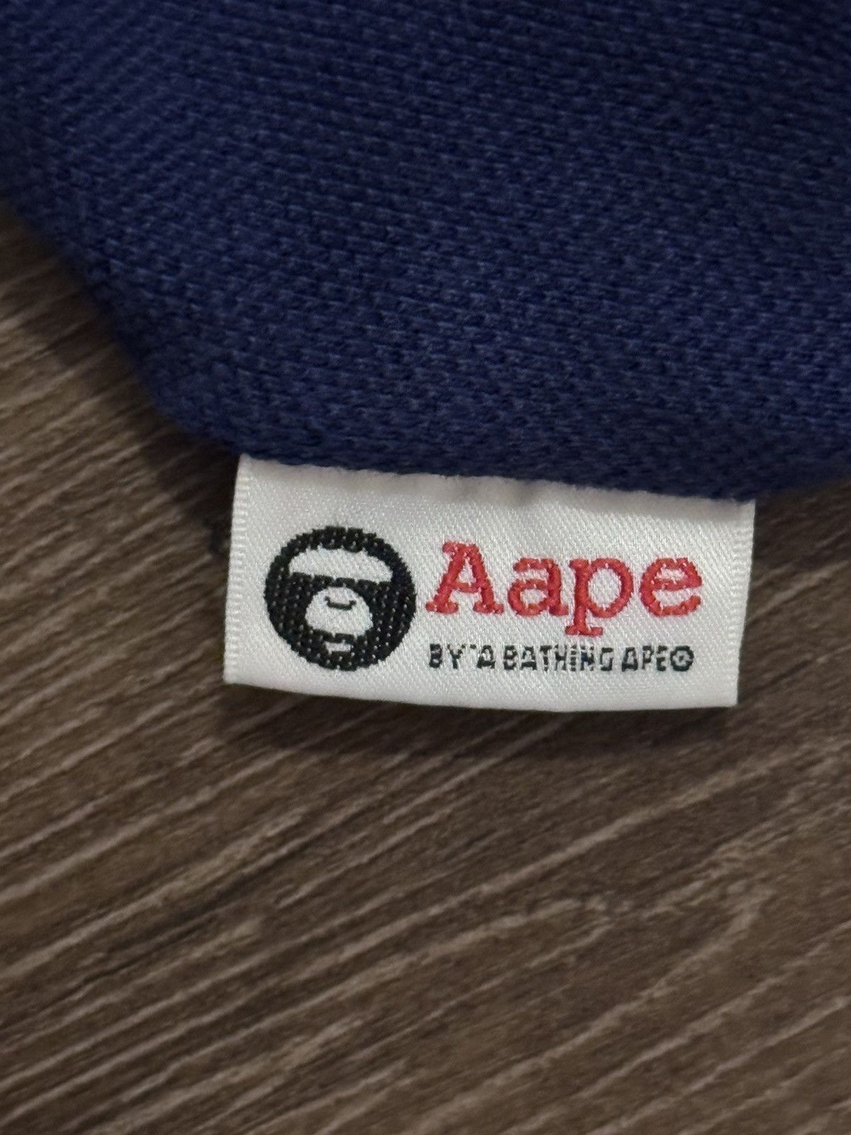 Aape polo shirt is from the brand AAPE BY A BATHING APE. Size US M / EU 48-50 / 2 - 12 Thumbnail