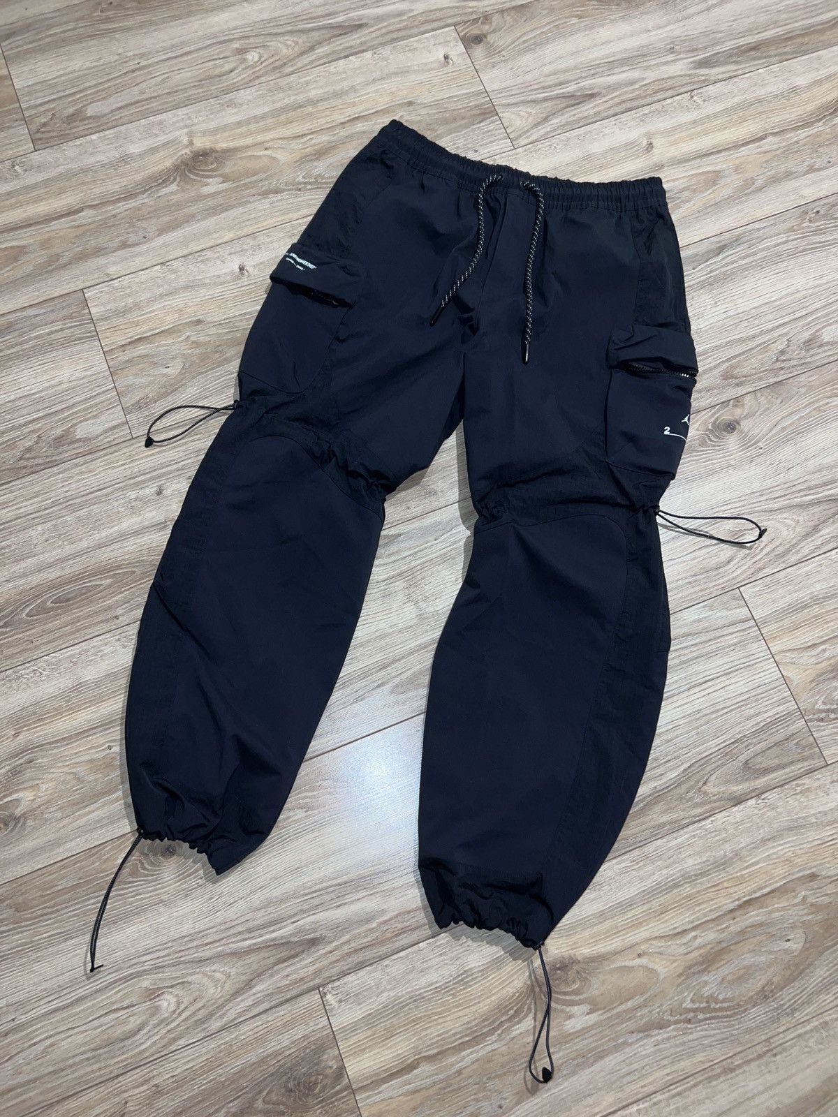 image of Jordan Nike Sweatpants Jordan Engineered 23 Nylon Y2K Drill Streetwear in Black, Men's (Size 36)