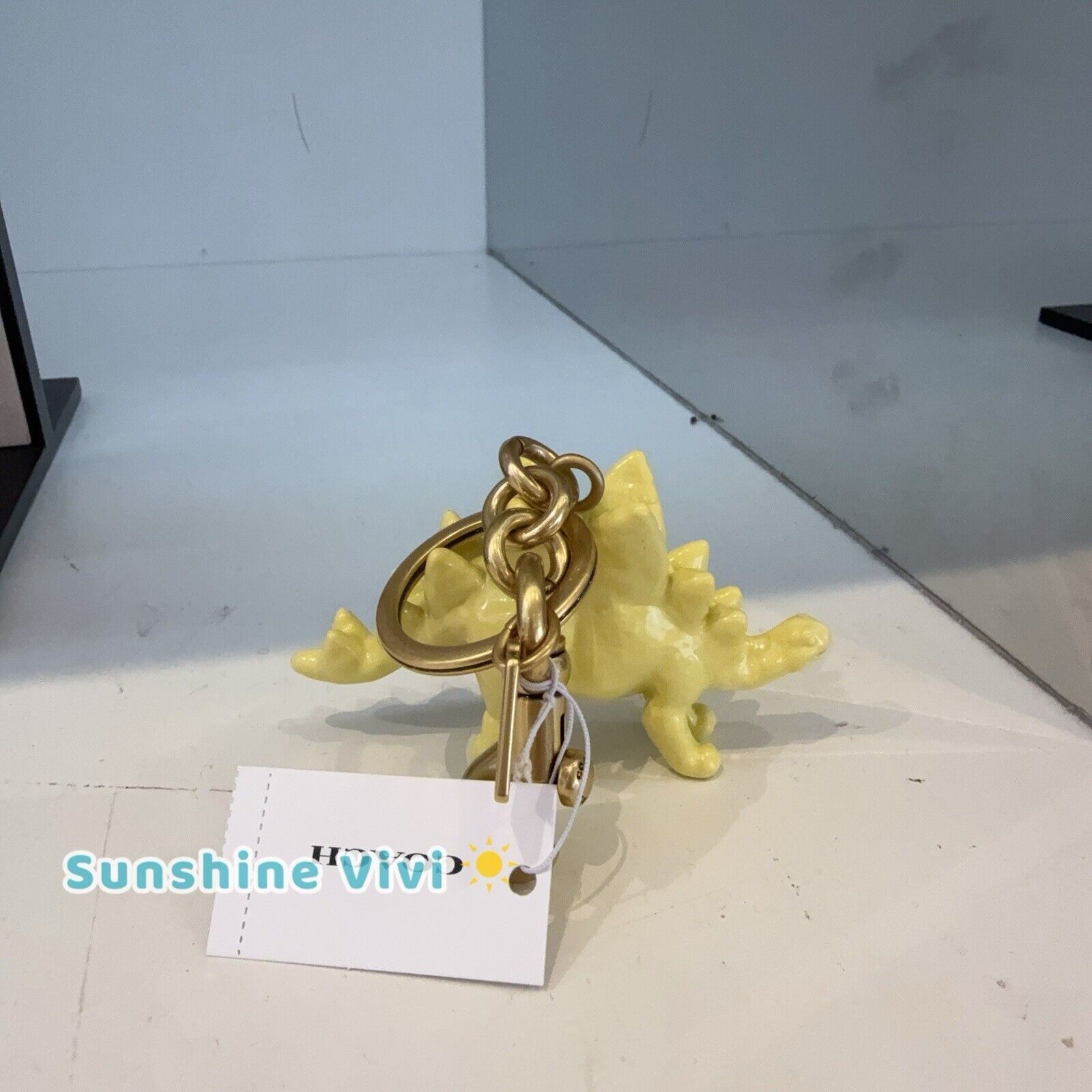 Coach NWT Coach CAX77 Keychain Stegosaurus Bag Charm Brass/Yellow Size ONE SIZE - 4 Thumbnail