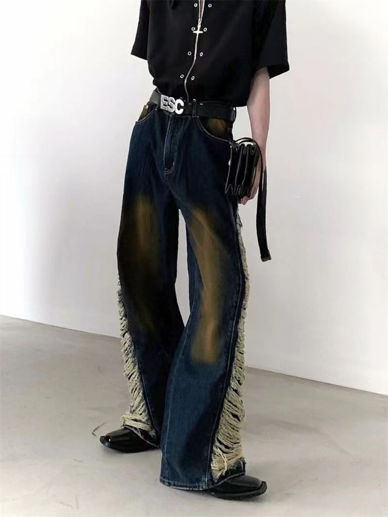 Vintage distressed patchwork fringed wide-leg jeans
