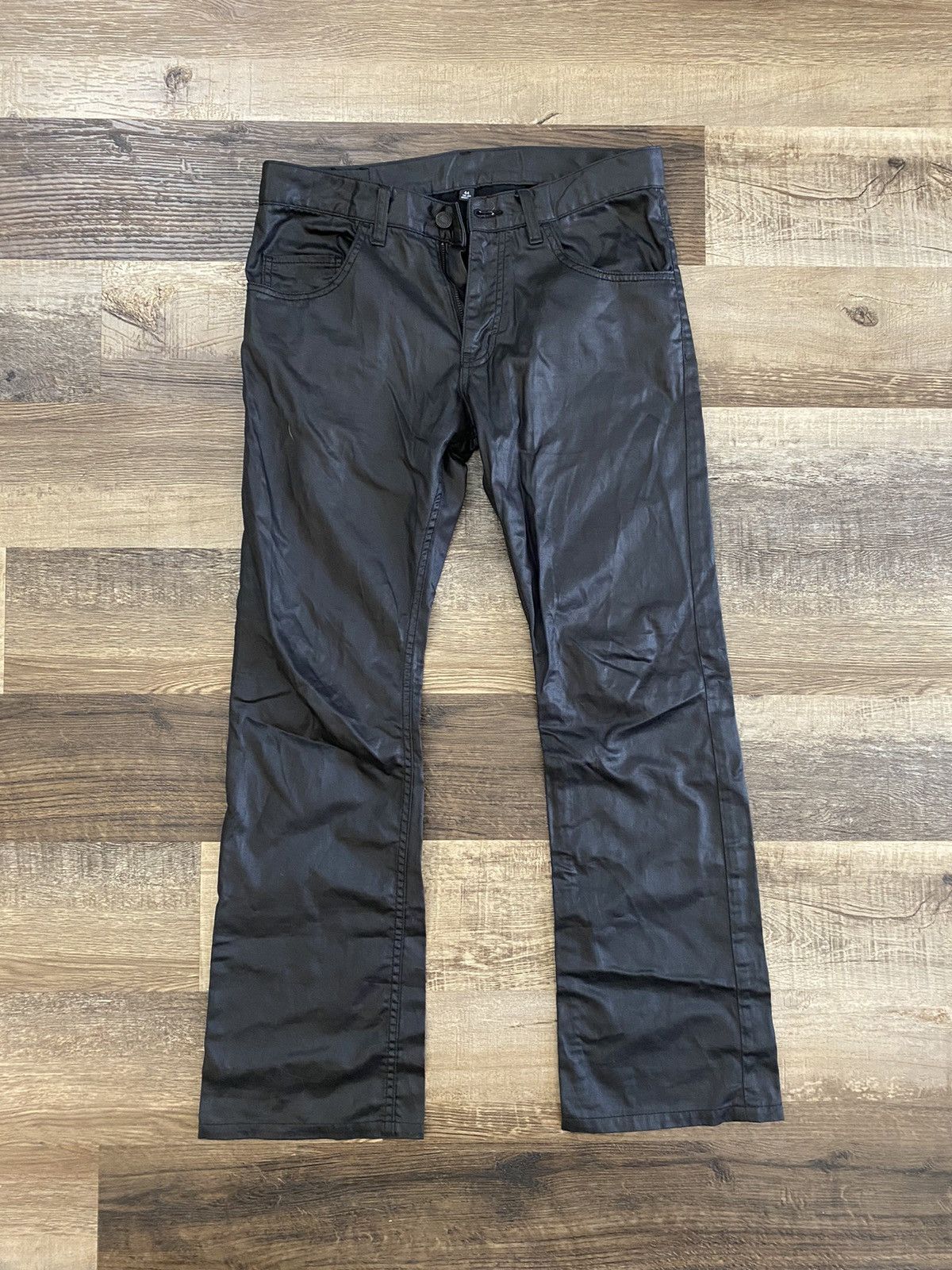 Lad Musician Lad Musician 2004 wax coated flare pants. | Grailed