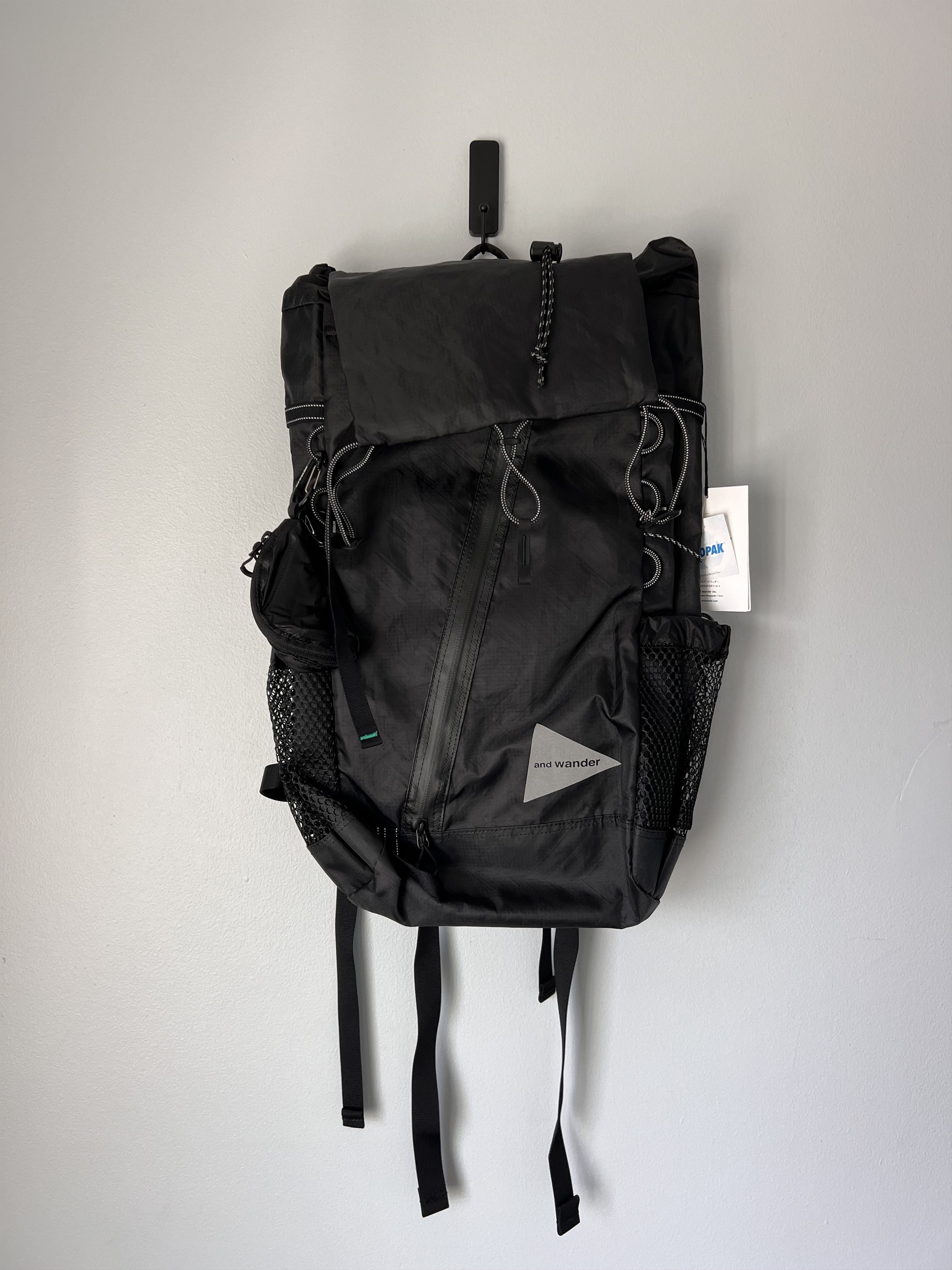And Wander and Wander Ecopak 30L Backpack in Black | Grailed