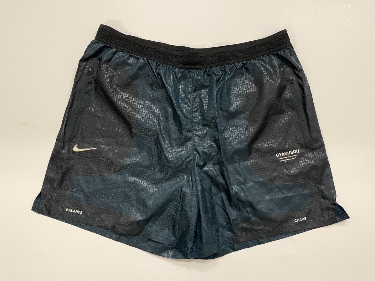 image of Gyakusou Embossed Running Shorts in Green, Men's (Size 36)