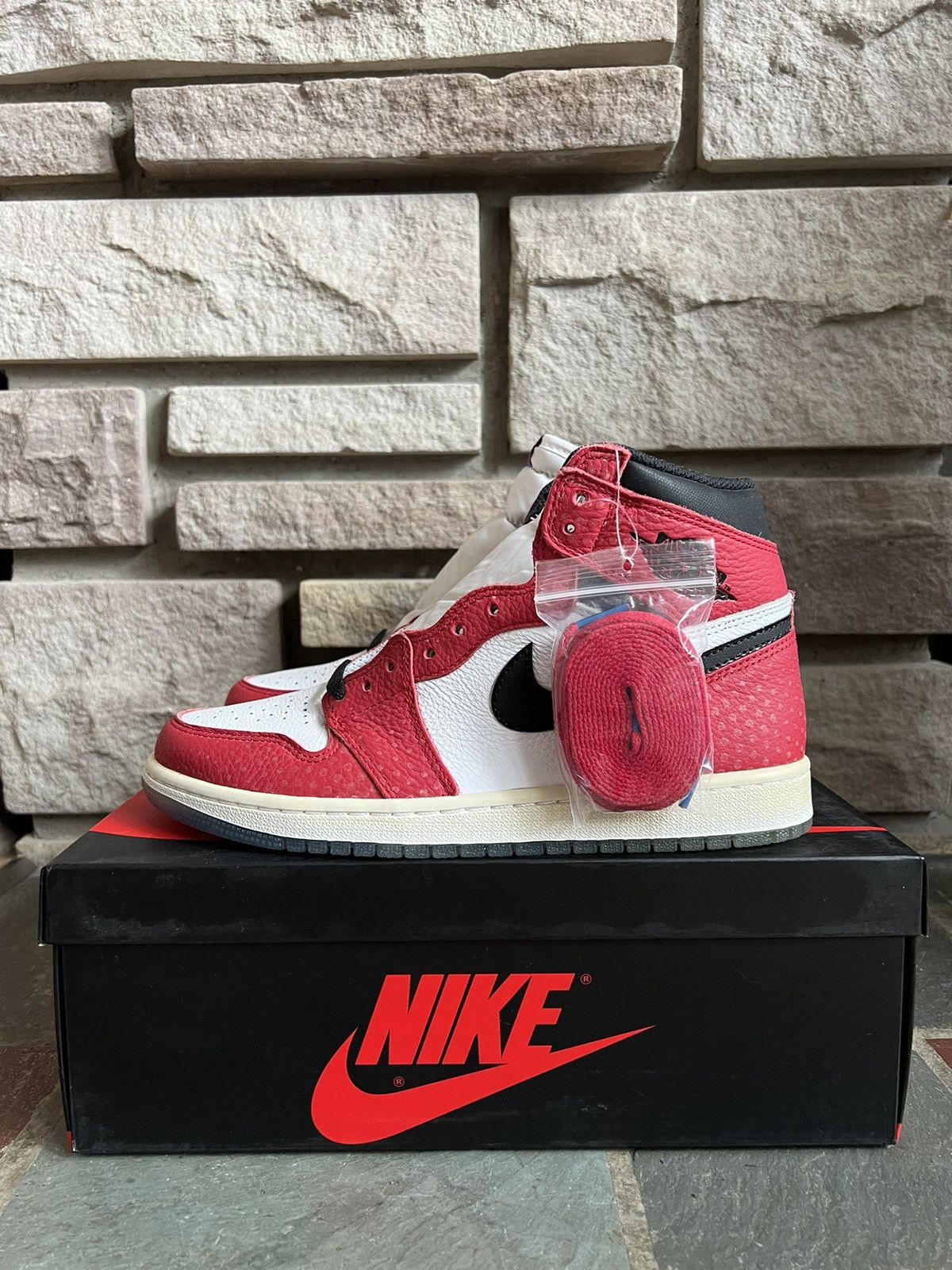 image of Jordan Nike Air Jordan 1 Retro High Spider-Man “Origin Story” Shoes in Red, Men's (Size 8)