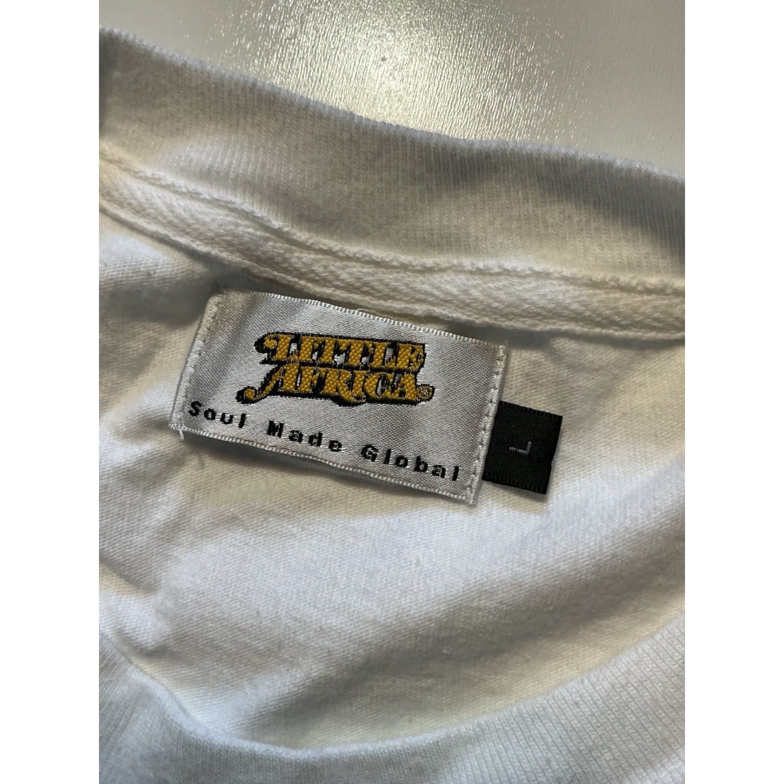 Vintage Little Africa Soul Made Global LA Graphic White Crewneck S/S T-Shirt Sz. L Mens Crew Neck T-Shirt White Graphic 90s? Size US L / EU 52-54 / 3 - 6 Thumbnail