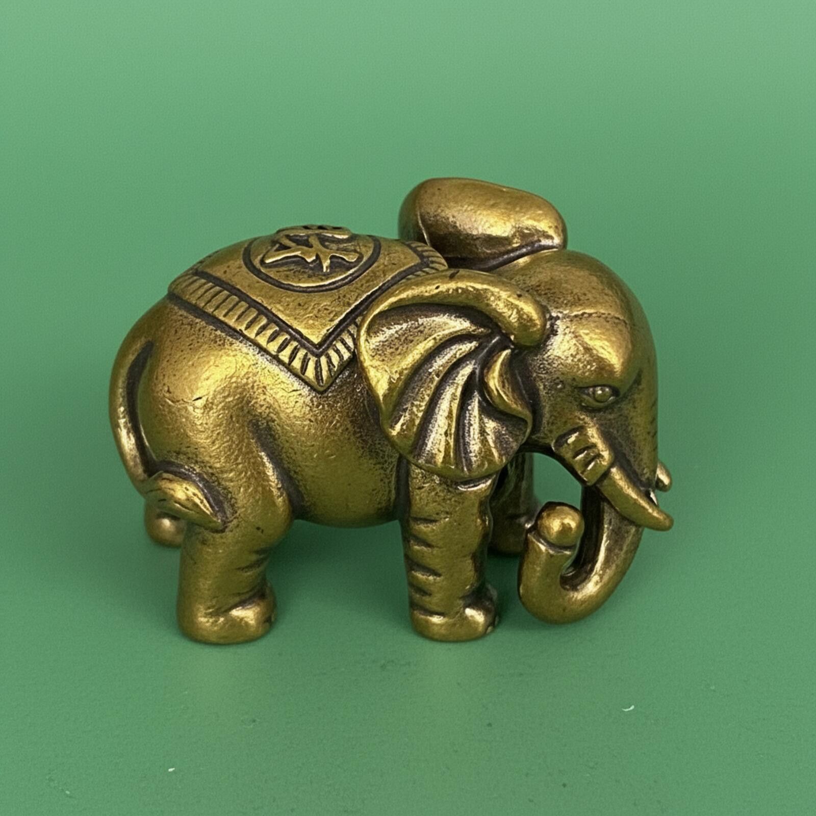 The Unbranded Brand Small Brass Elephant Trunk Down Figurine with Saddle Size ONE SIZE - 1 Thumbnail