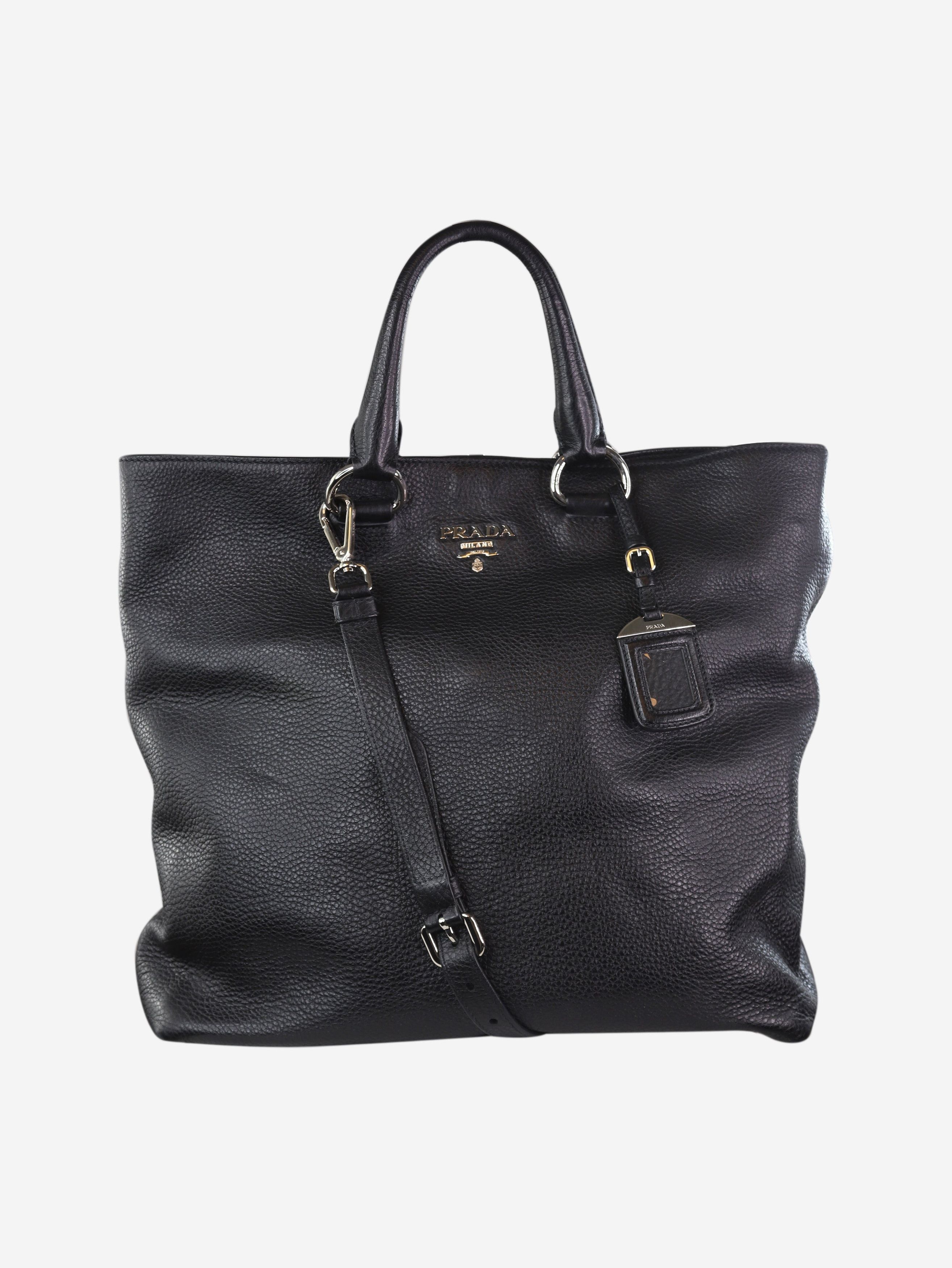 Black leather tote bag with brand lettering