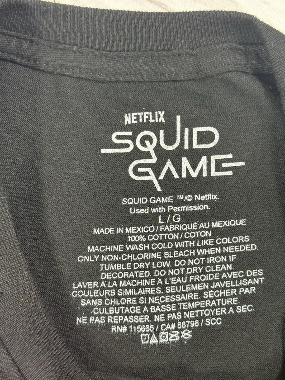 Other Squid Game Doll Neon Graphic TShirt Men’s Netflix Black L #8 Size US L / EU 52-54 / 3 - 5 Thumbnail