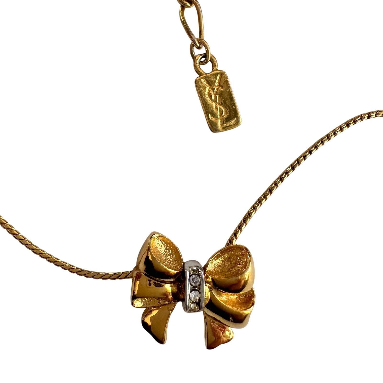 Yves Saint Laurent Yves Saint Laurent Gold and Rhinestone Bow Necklace Size ONE SIZE - 8 Thumbnail