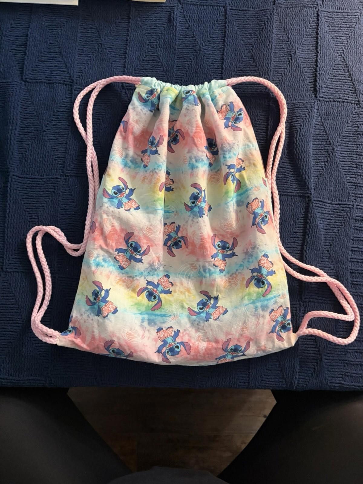 The Unbranded Brand Handmade Lilo &Stitch drawstring bag on tie-dye fabric. Size ONE SIZE - 2 Thumbnail