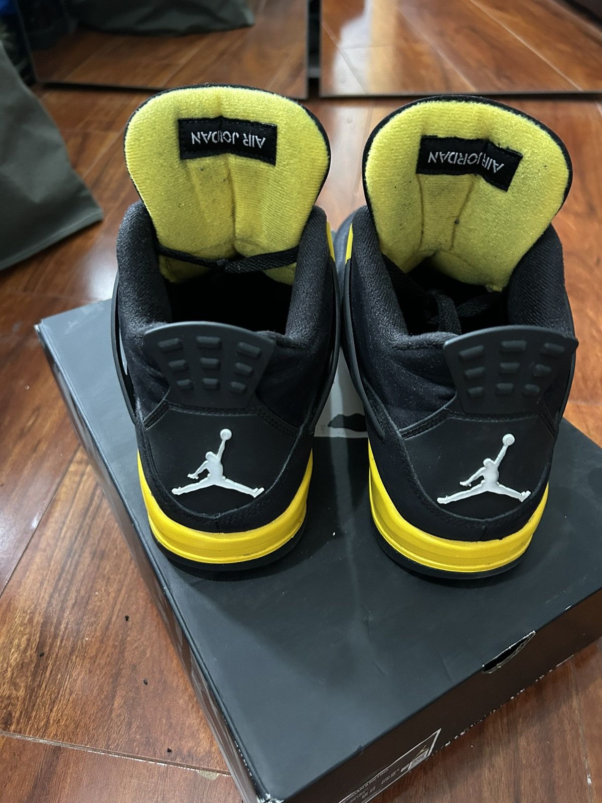 Nike Jordan 4 Retros black and yellow Size US 9 / EU 42 - 3 Thumbnail