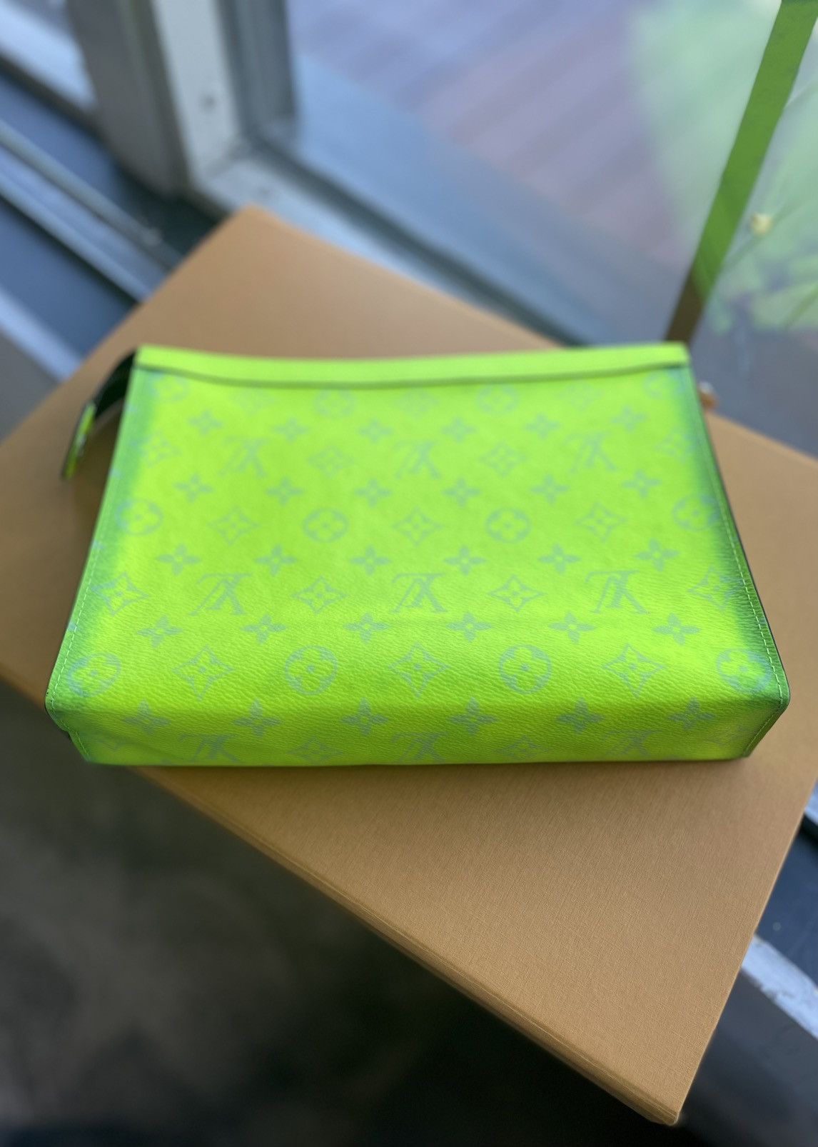 Louis Vuitton Pochette Voyage MM Taiga Rama Clutch Bag