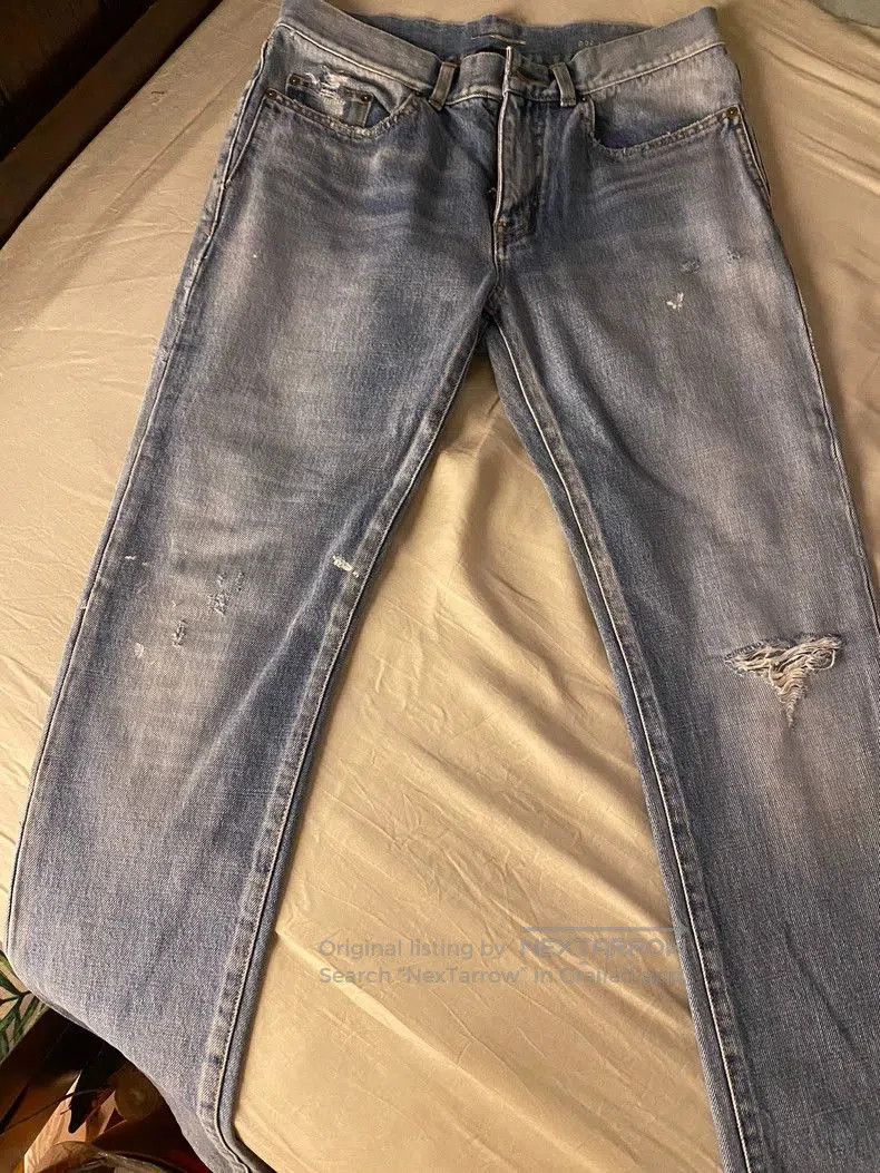Saint Laurent Distressed Slim Fit Jeans.