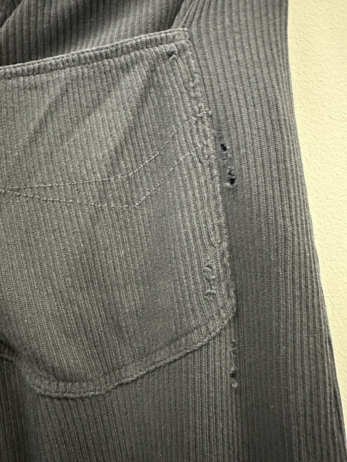 Distressed-effect trousers