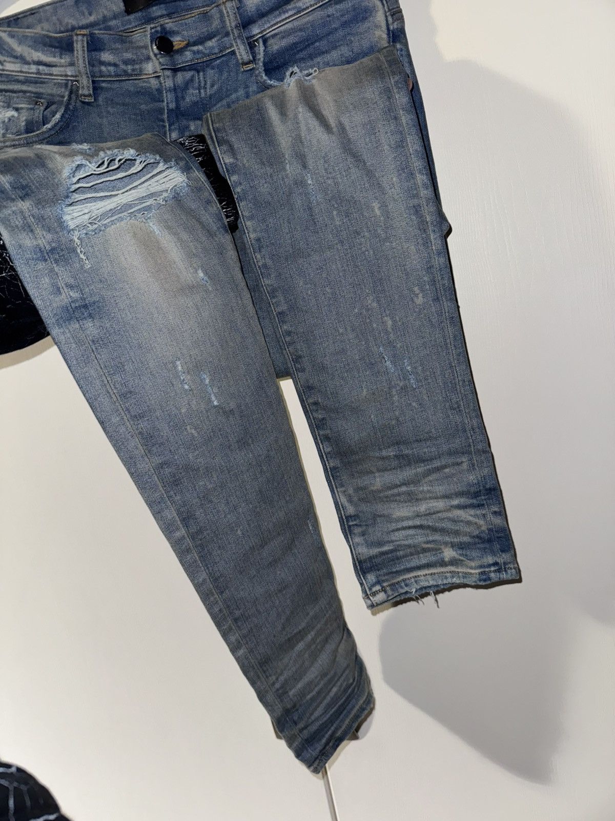 AMIRI BLUE DISTRESSED JEANS
