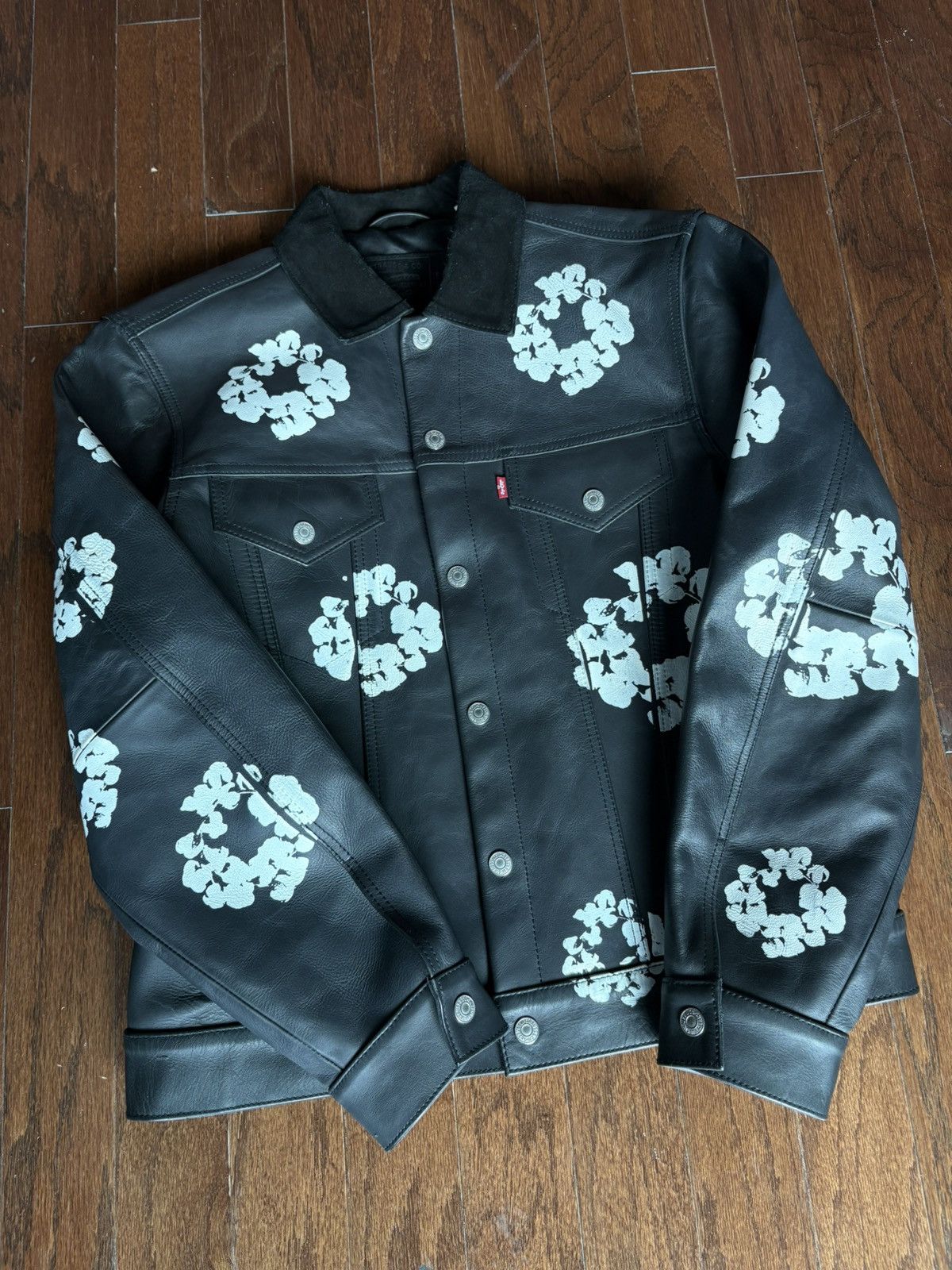 DENIM TEARS Denim Tears Leather Embossed Wreath Puffer Jacket