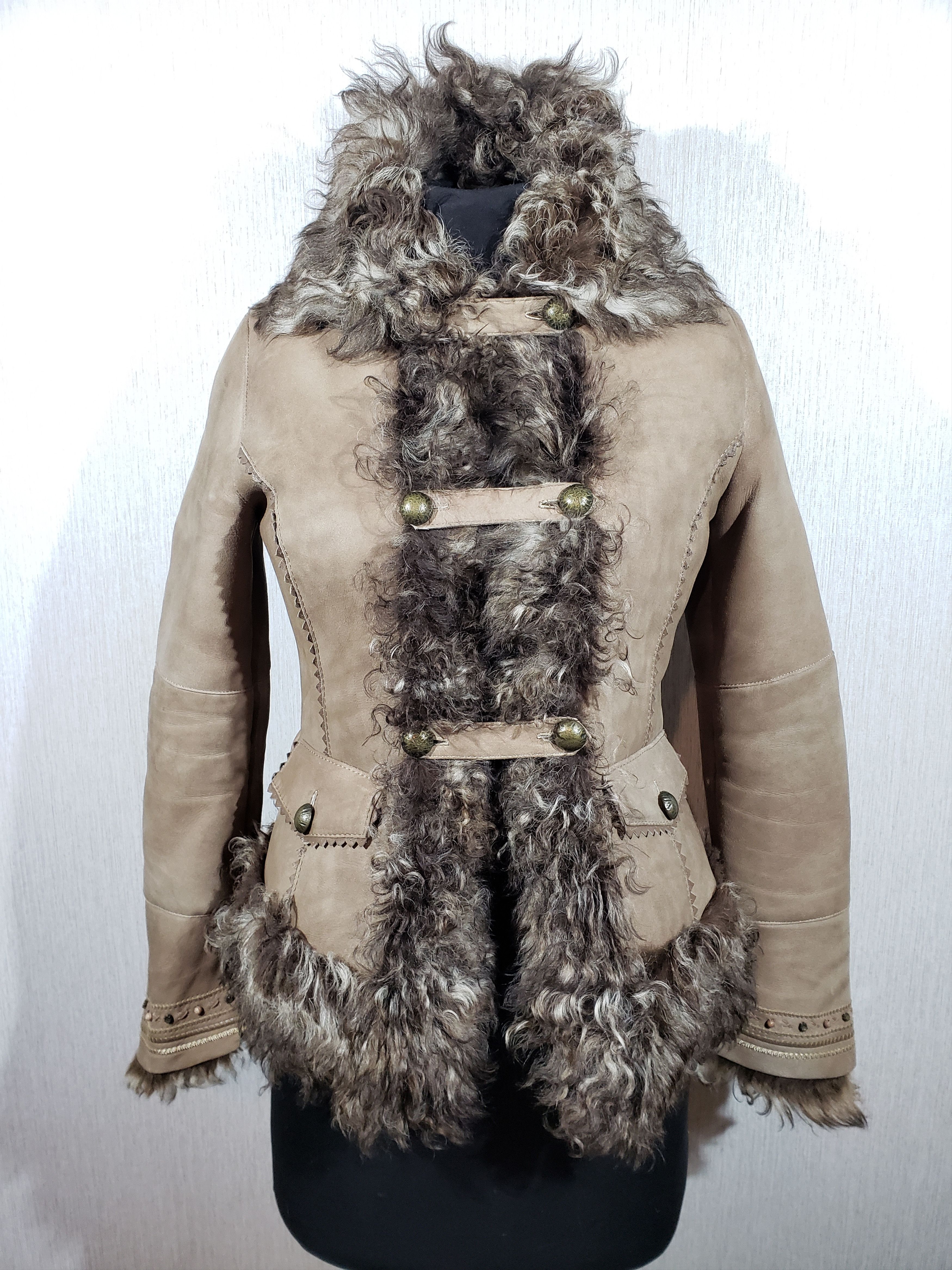 Cute gray women's sheepskin coat with buttons.