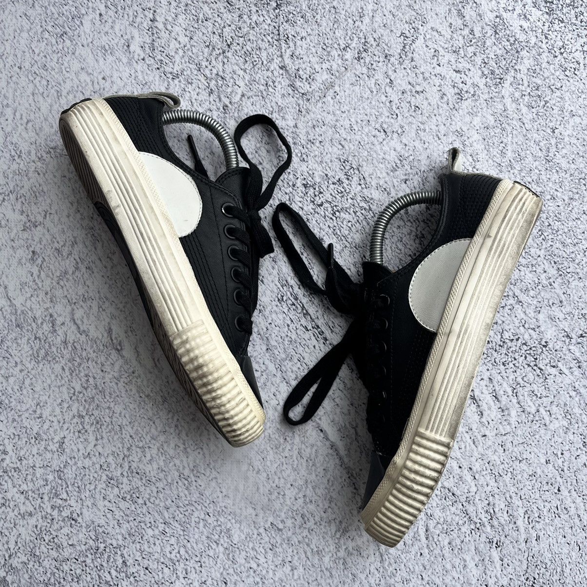 Alexander McQueen Black leather swallow plimsoll sneakers