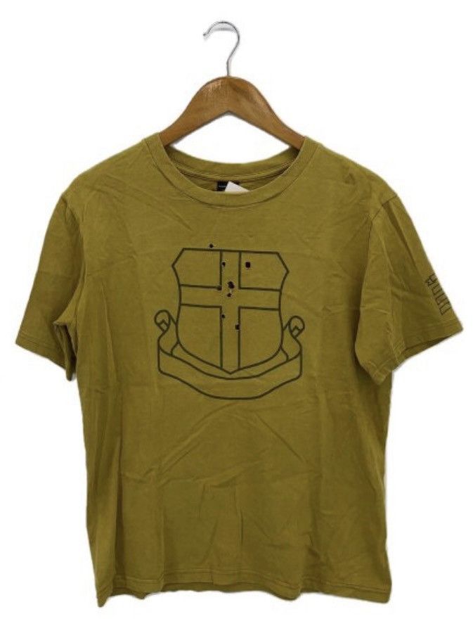 Number (N)ine Gun holes Shield Crest