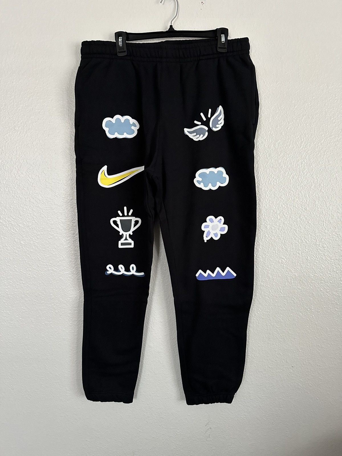 image of Nike Sportswear Doodle Floral Have A Nike Day Jogger Pants in Black, Men's (Size 38)