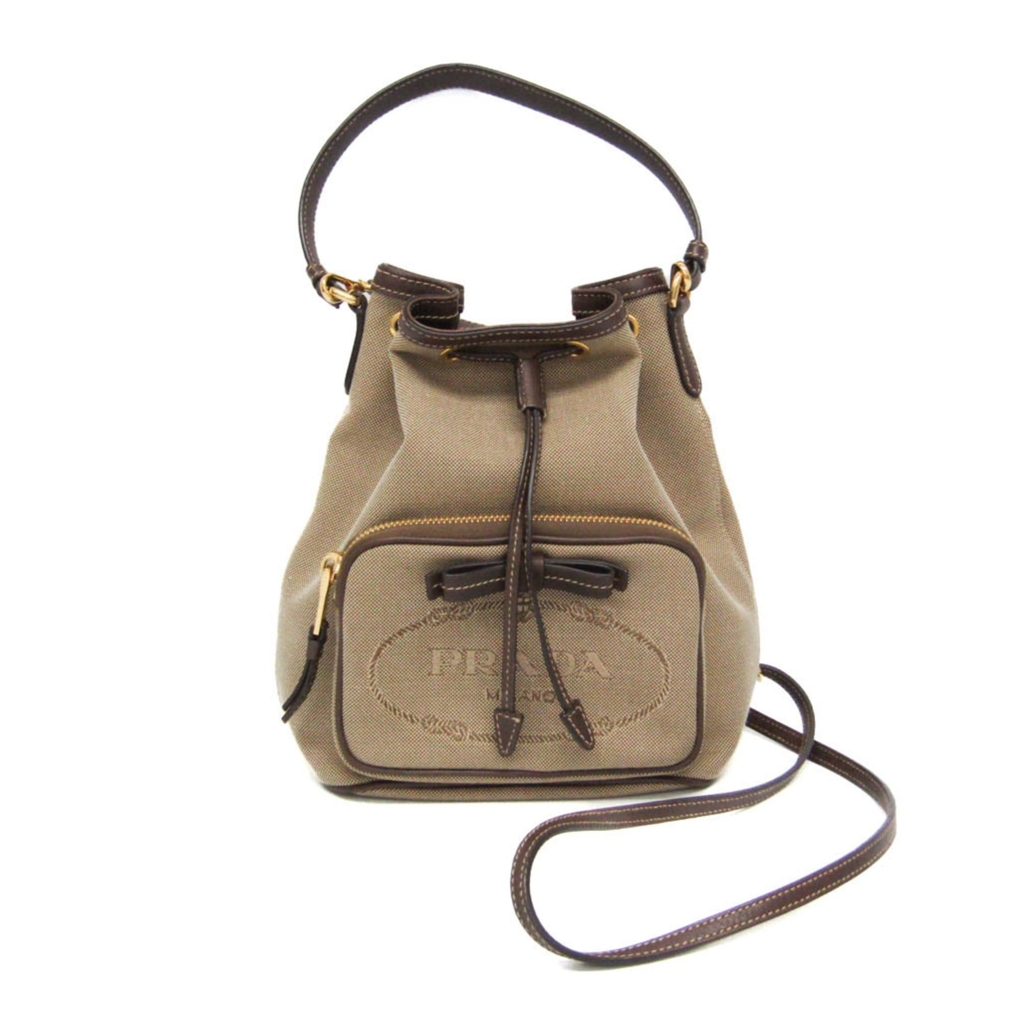 Prada Prada Logo Jacquard Drawstring Bag Women's Leather,Jacquard Handbag,Shoulder Bag Beige Brown,Dark Brown Size ONE SIZE - 1 Thumbnail