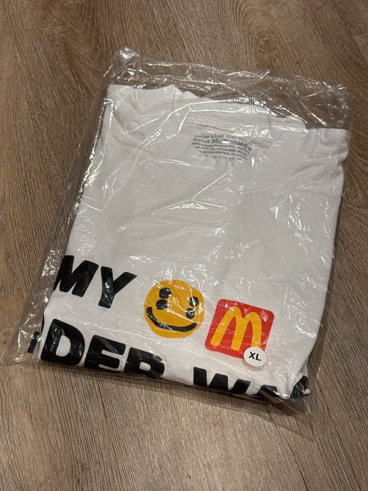 Image of Cactus Plant Flea Market X Mcdonald’S Worth The Wait T-Shirt in White, Men's (Size XL)