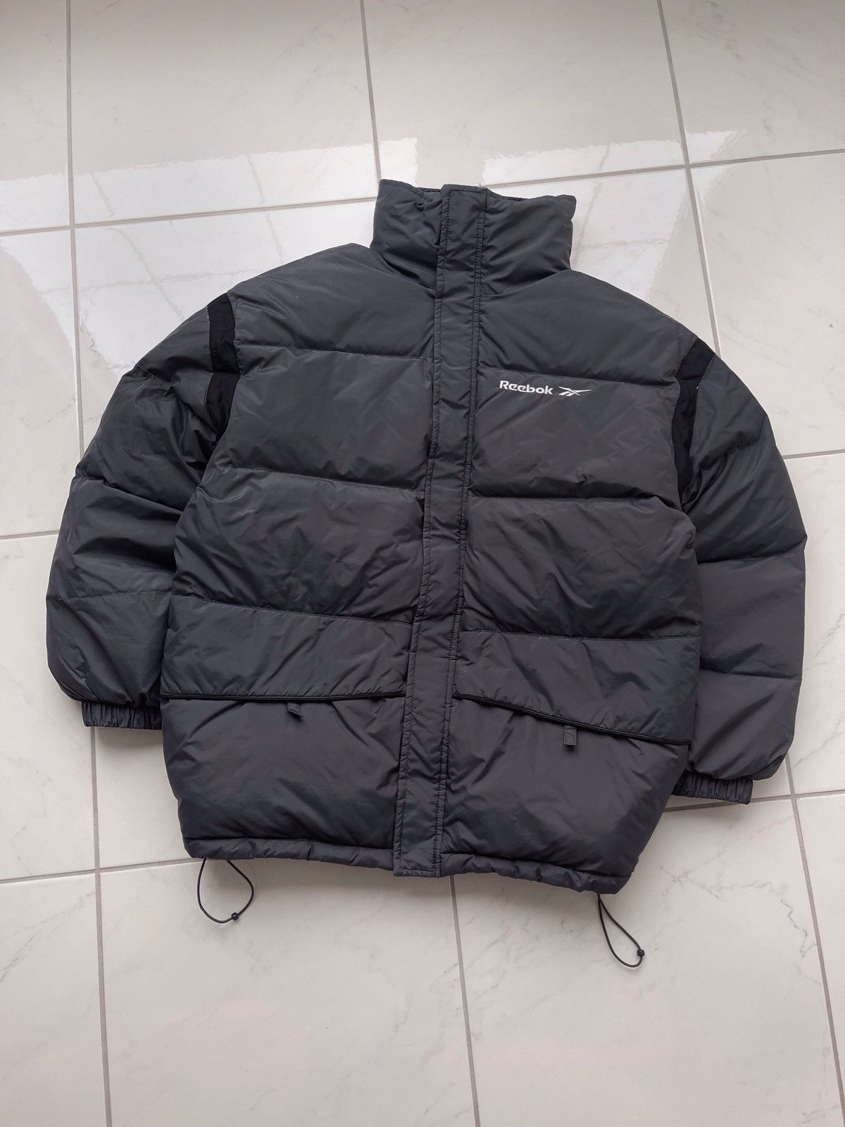 image of Y2K Reebok Vintage Puffer Jacket in Grey, Men's (Size Medium)