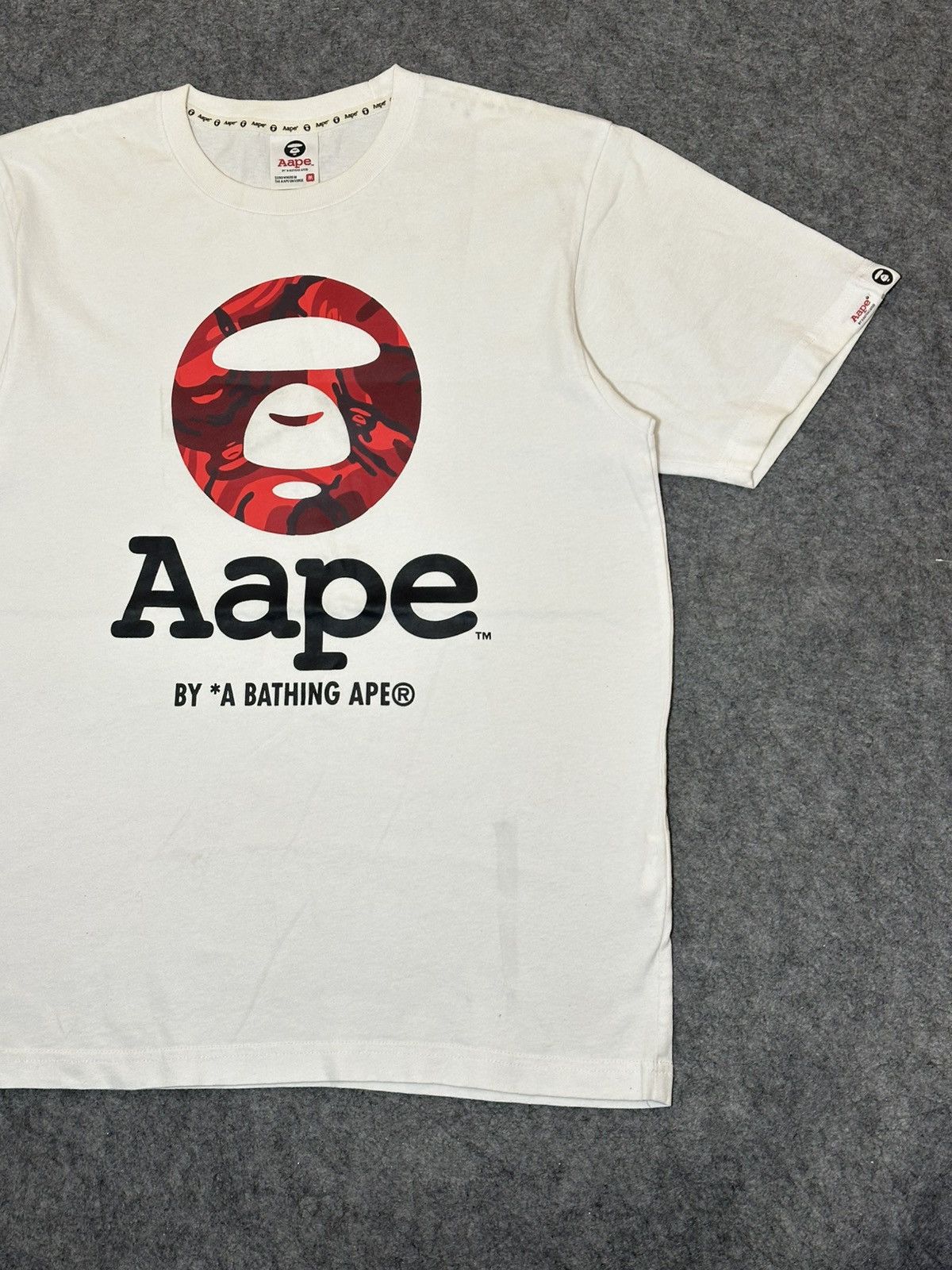 Aape AAPE by A Bathing Ape Moon Face Camo T-shirt in white. Size US M / EU 48-50 / 2 - 6 Thumbnail