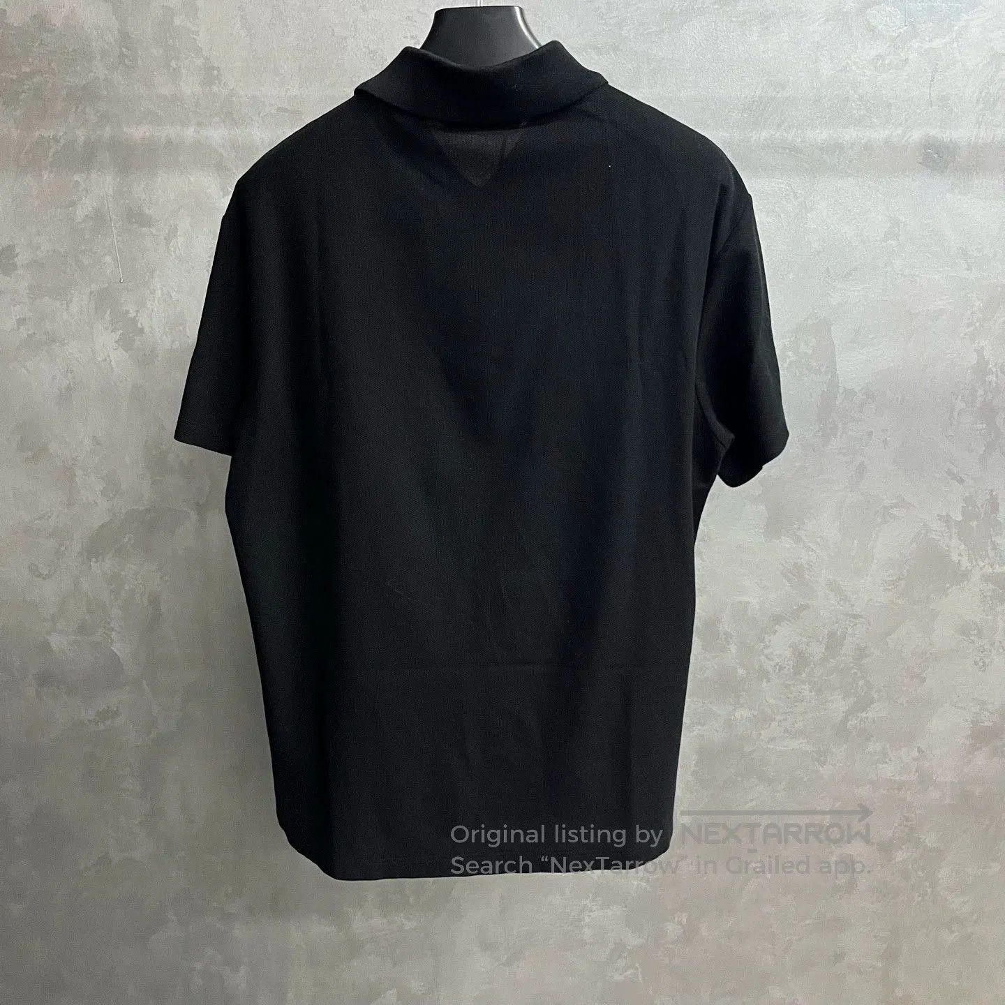 black louis vuitton embroidered logo polo shirt.