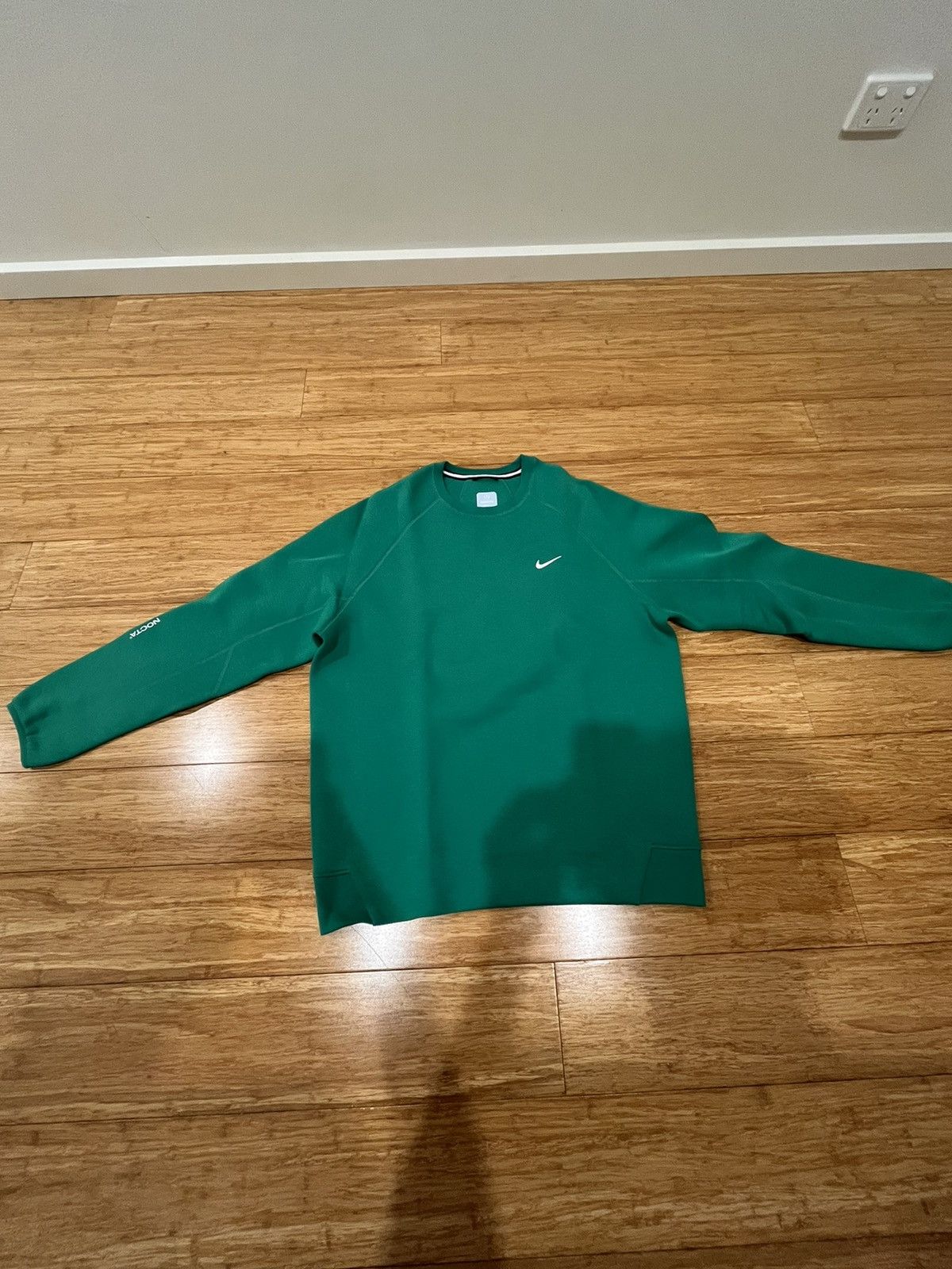 image of Nike Nocta Tech Sweatshirt in Green, Men's (Size Large)